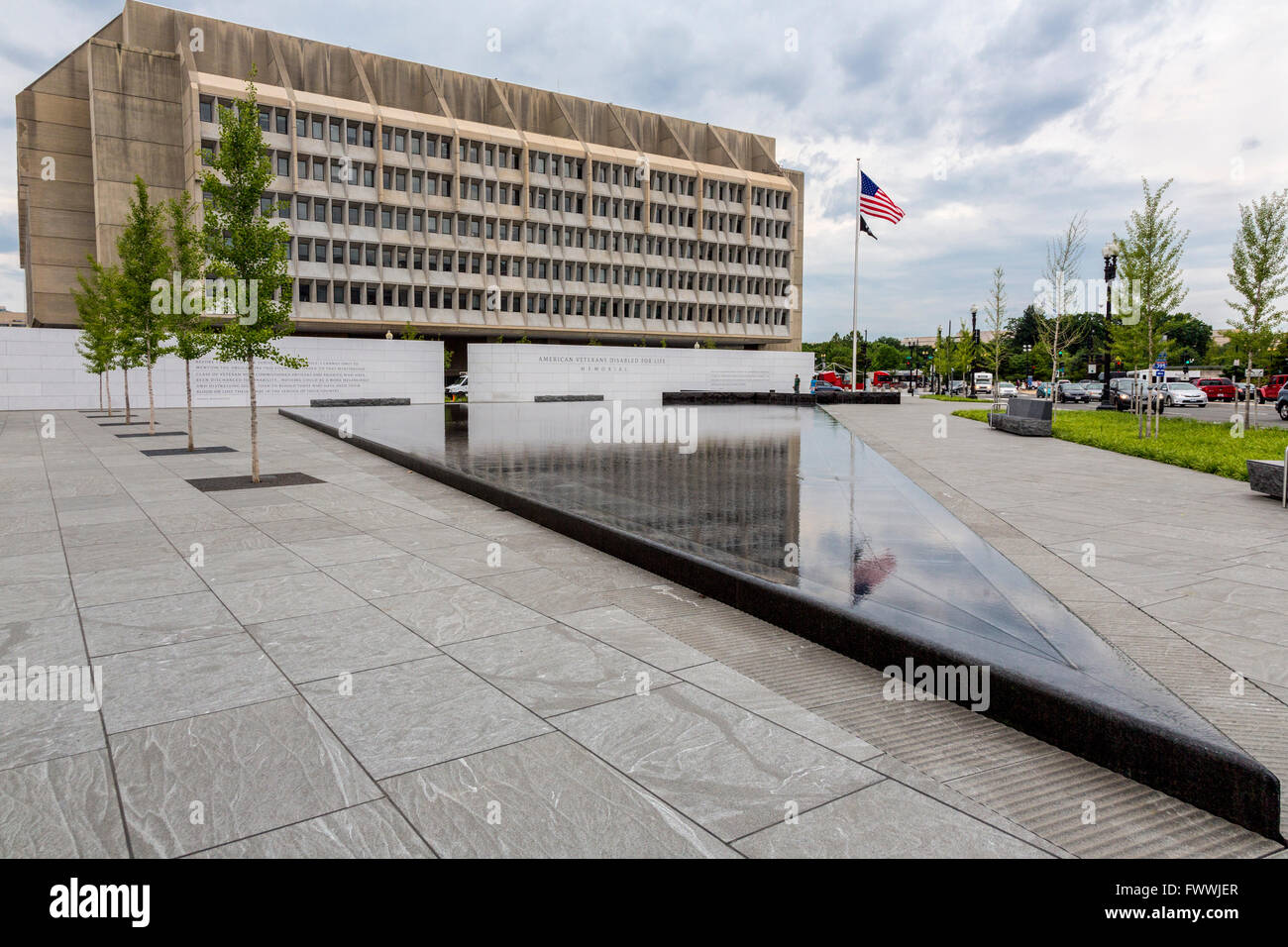 Washington, D.C., USA.  American Veterans Disabled for Life Memorial in Foreground.  Health and Human Services in Background. Stock Photo