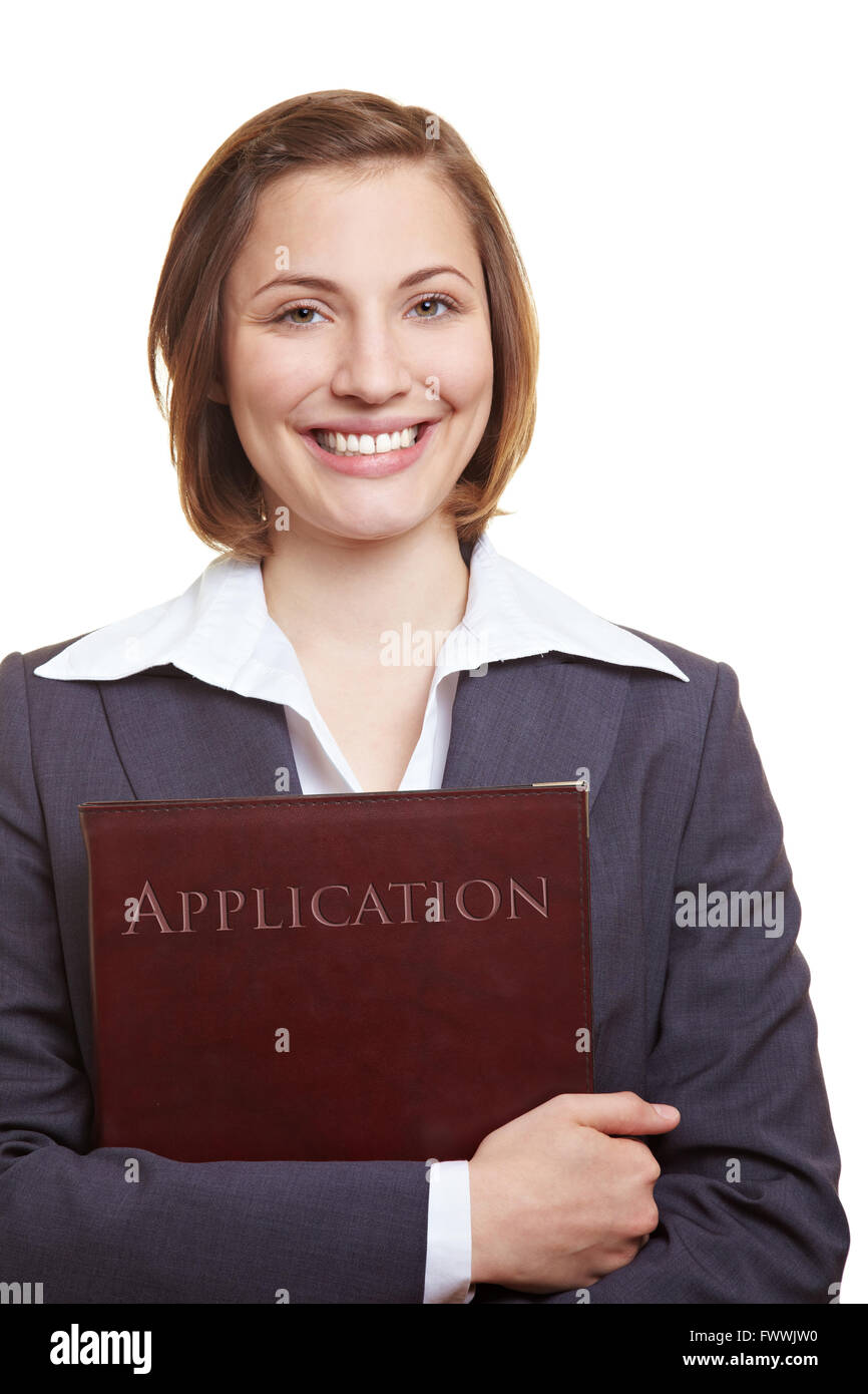 Smiling female applicant holding application folder in her hands Stock Photo