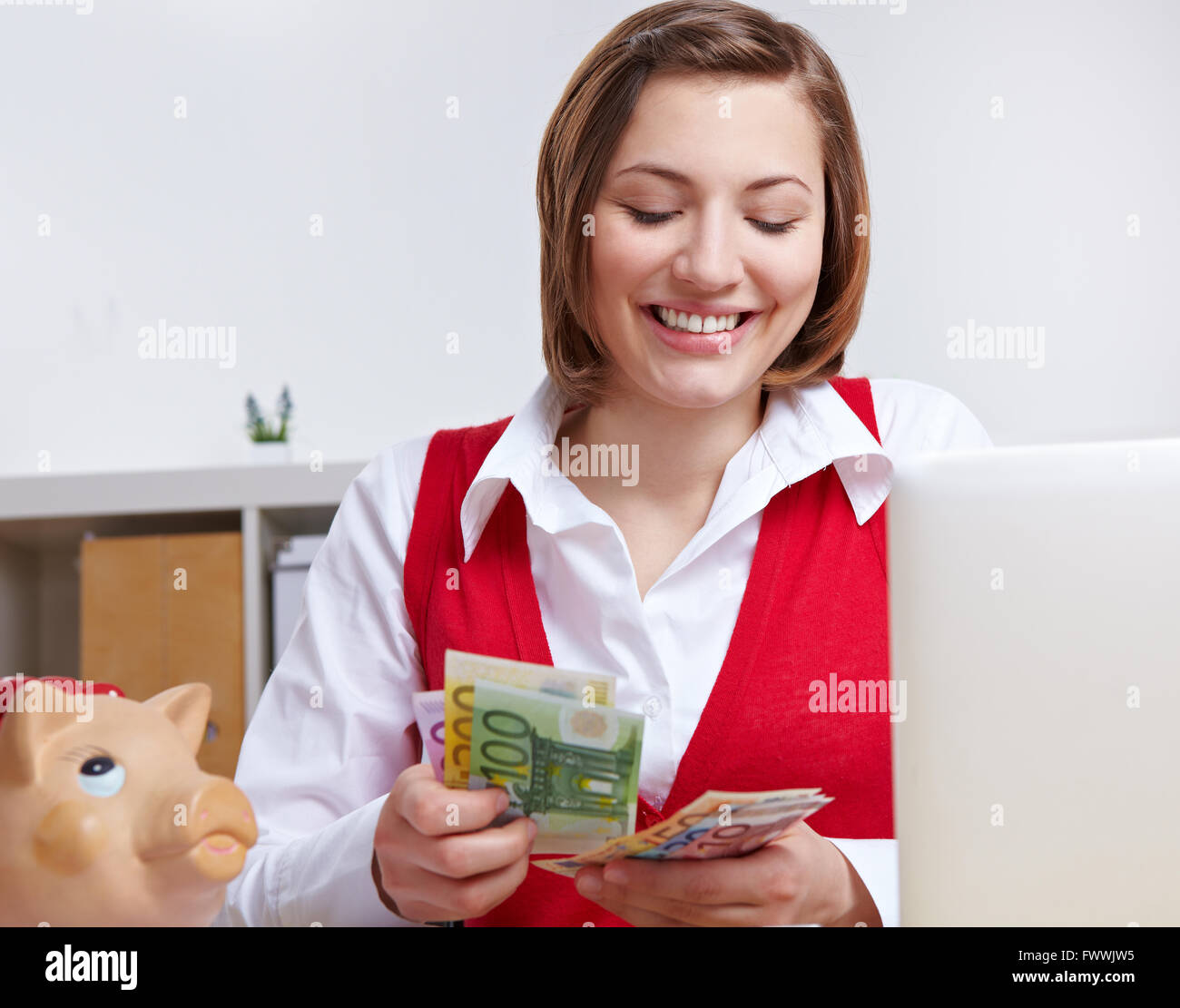 Happy business woman in office counting Euro money at her desk Stock ...