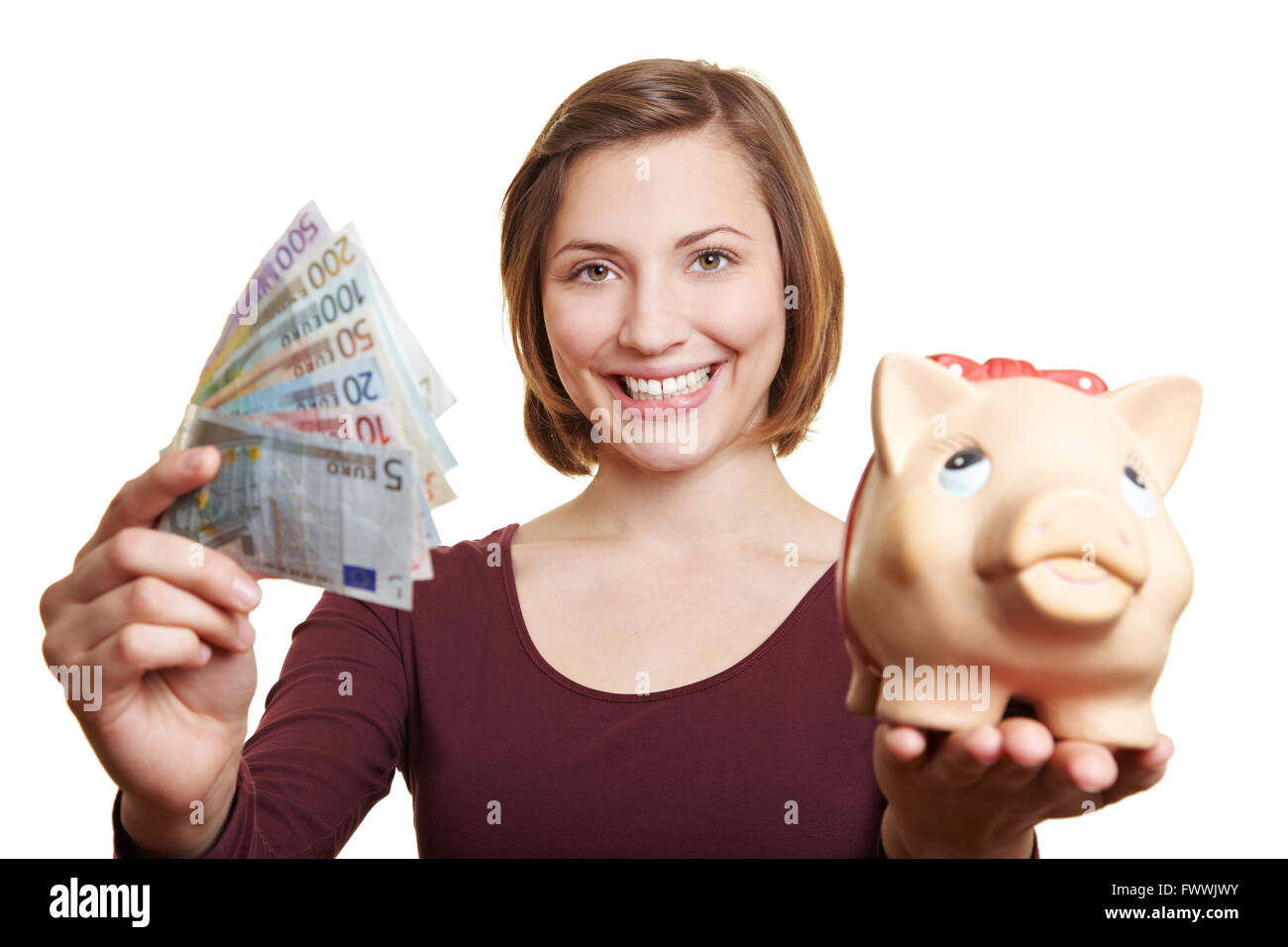 Happy woman holding Euro money bill fan and piggy bank Stock Photo - Alamy