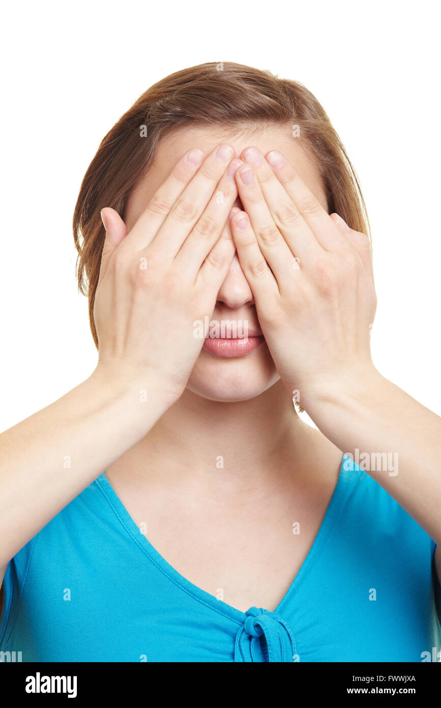 Young woman covering her eyes with both hands Stock Photo Alamy