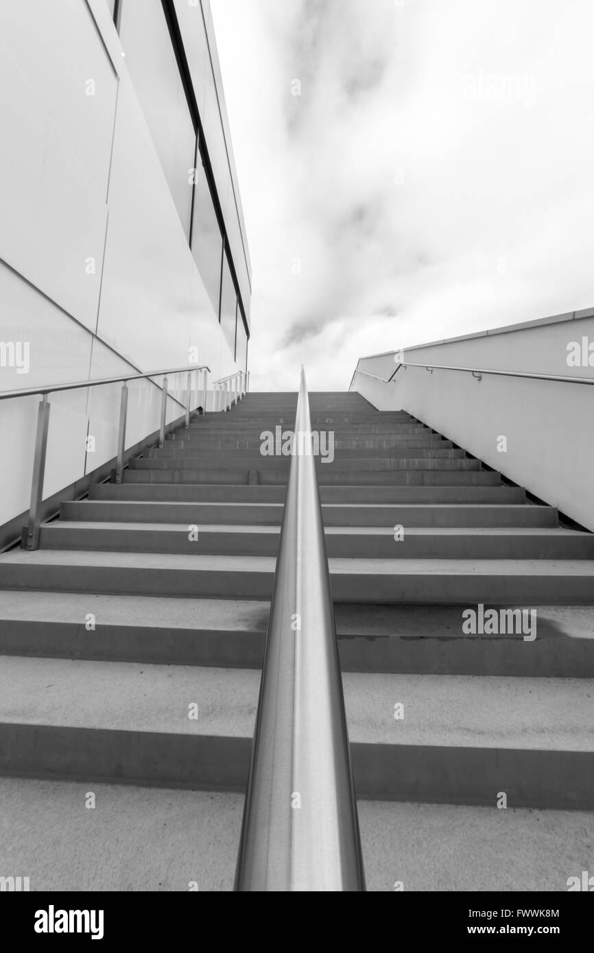 Steps with Railing by Building in black and white. Stock Photo
