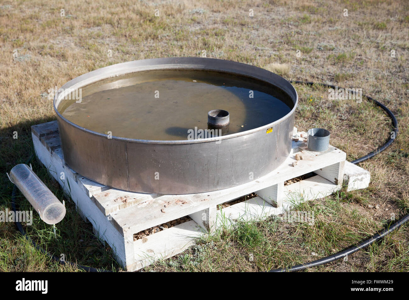 Evaporation pan, part of a weather station in Canada Stock Photo