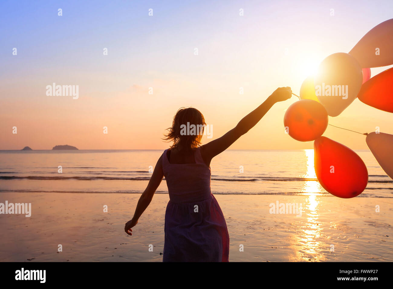 happiness concept, happy girl with multicolored balloons, joy and positive emotions Stock Photo
