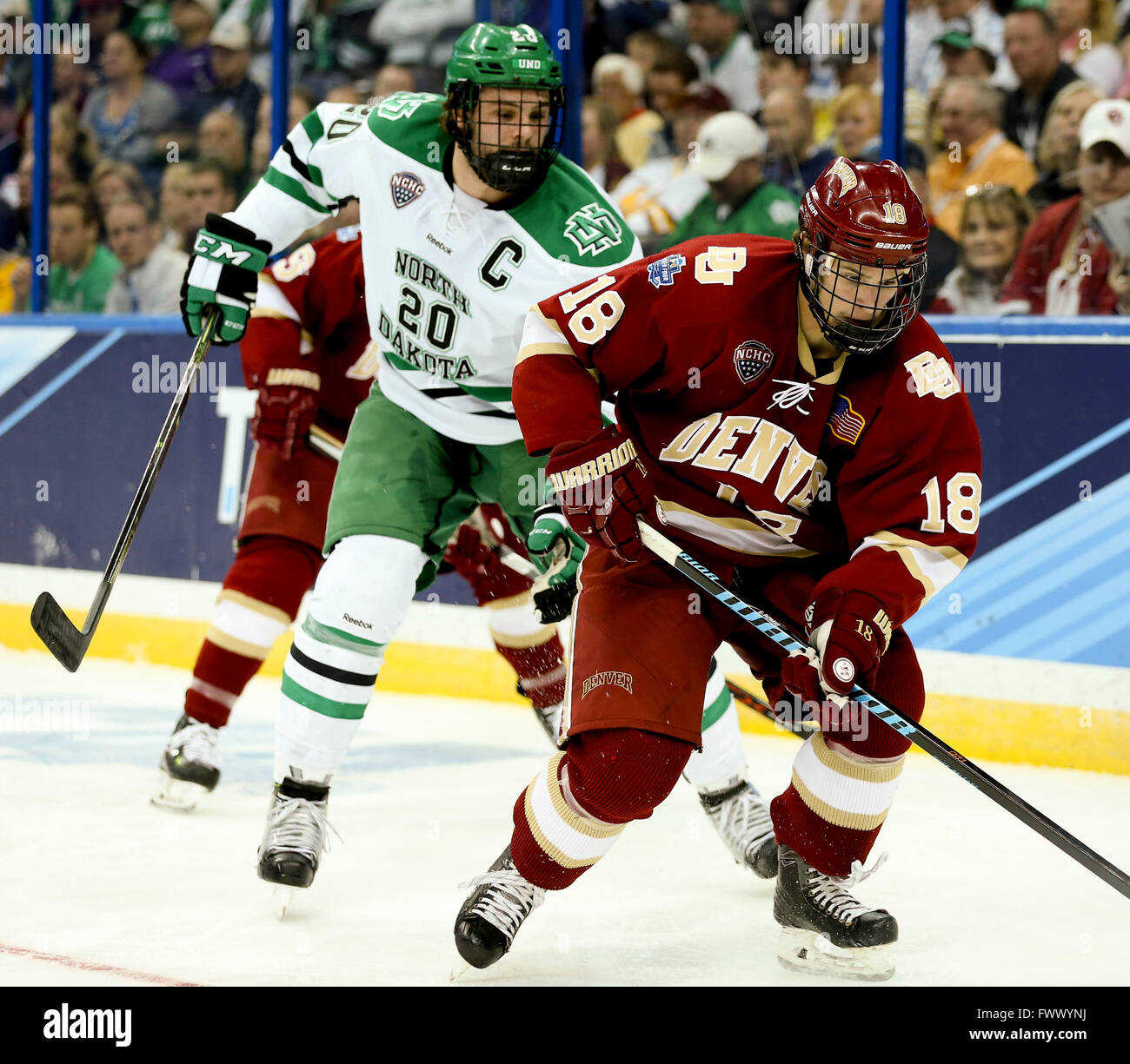 Tampa, Florida, USA. 7th Apr, 2016. DIRK SHADD | Times .Denver Pioneers forward Emil Romig (18) stick handles with the puck against North Dakota Fighting Hawks defenseman Gage Ausmus (20) during first period action of game two Frozen Four semifinals at Amalie Arena on Thursday (04/07/16) © Dirk Shadd/Tampa Bay Times/ZUMA Wire/Alamy Live News Stock Photo