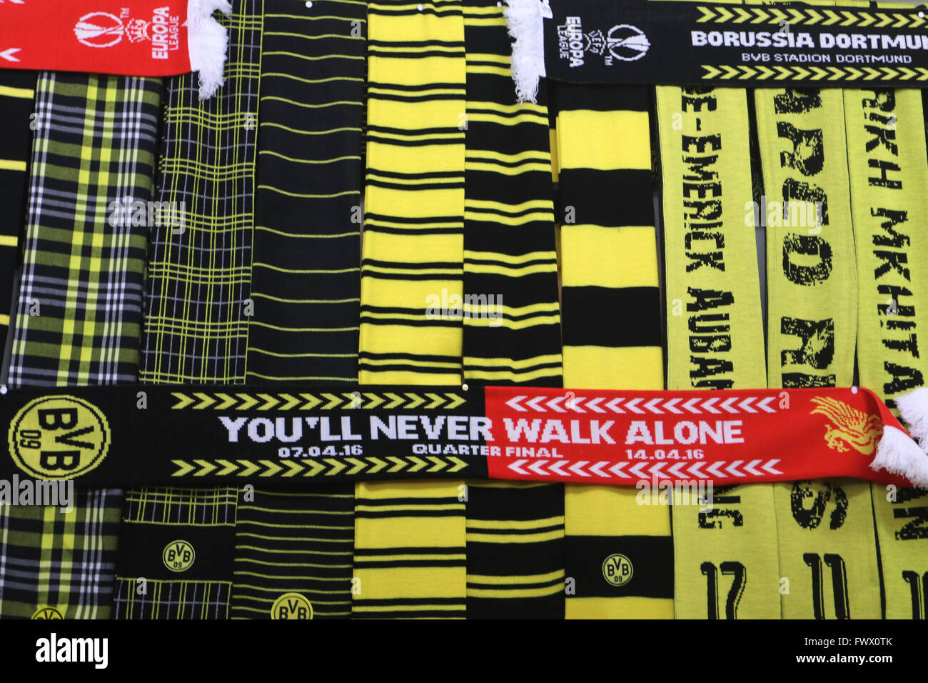 Dortmund, Germany. 7th Apr, 2016. Fan scrafs of soccer clubs Borussia Dortmund and FC Liverpool are on display at a sales shop at the Signal Iduna Park soccer stadium, prior to the Europa League knock out quarter finals between Borussia Dortmund vs FC Liverpool in Dortmund, Germany, 7 April 2016. Photo: Ina Fassbender/dpa/Alamy Live News Stock Photo