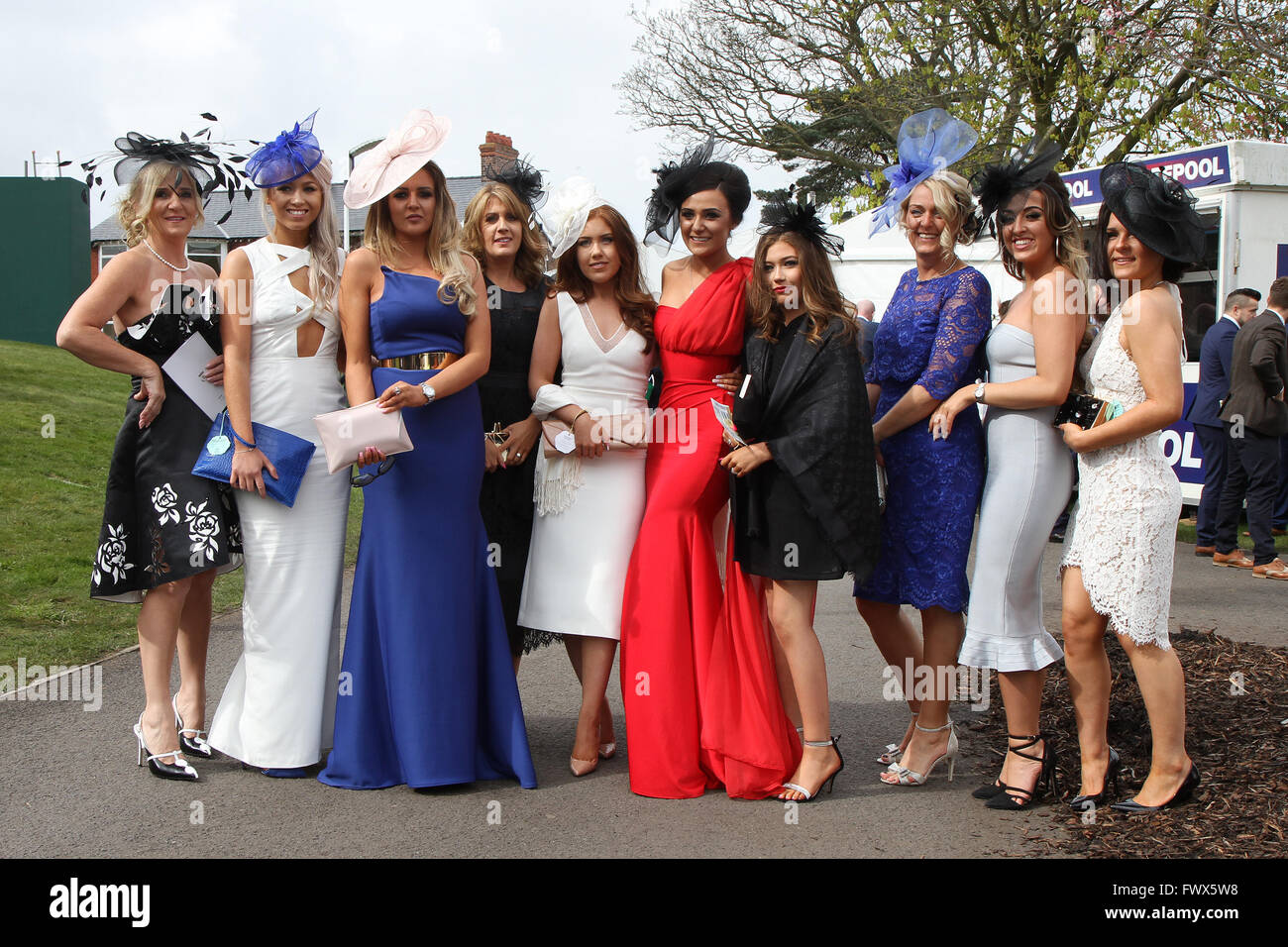 Aintree, Liverpool, UK. 08th Apr, 2016. Crabbies Grand National Festival Day 2. Ladies arriving pose for a photo. Credit:  Action Plus Sports/Alamy Live News Stock Photo
