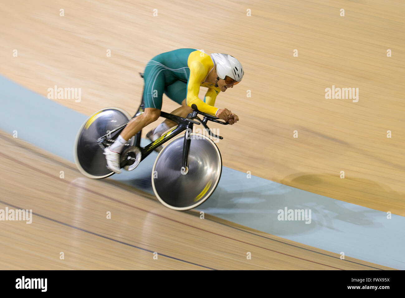 A cyclist competing at the velodrome at the Emirates Arena in Glasgow during the 2014 Commonwealth Games. Stock Photo