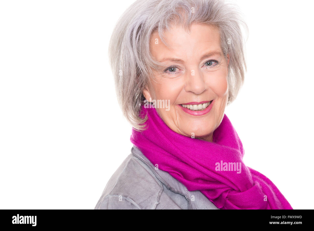 Portrait from a smiling senior woman in front of white background Stock ...