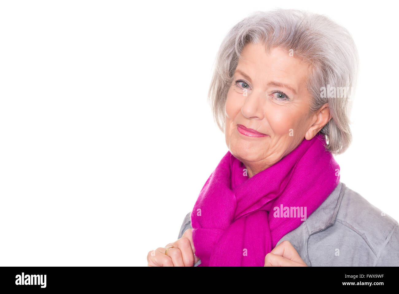 Portrait from a smiling senior woman in front of white background Stock ...