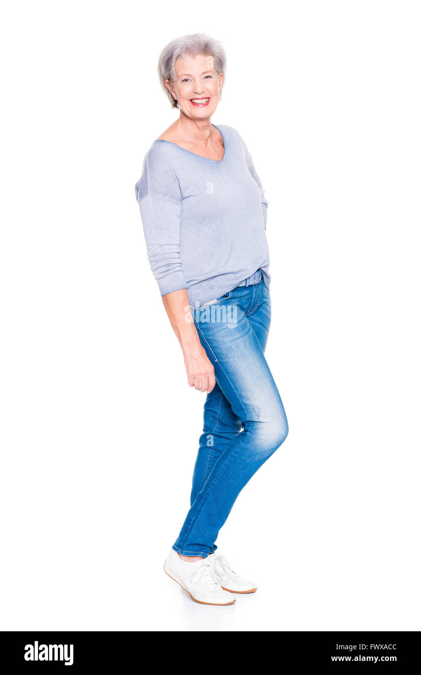 Senior woman standing in front of white background Stock Photo - Alamy