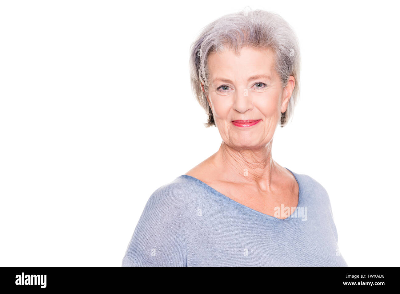 Smiling senior woman in front of white background Stock Photo - Alamy
