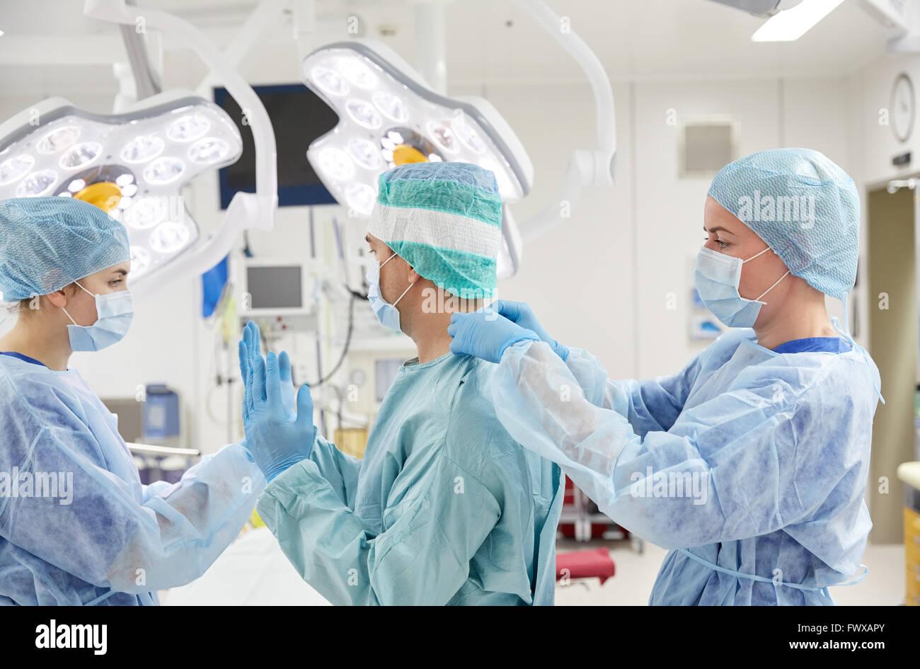 surgeons in operating room at hospital Stock Photo - Alamy