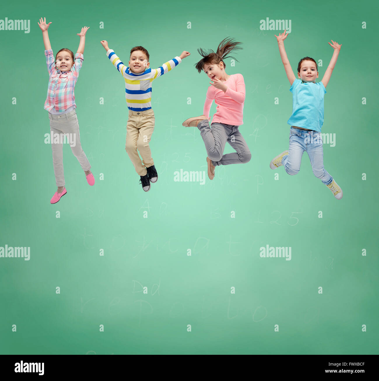 happy little girl jumping in air over school board Stock Photo - Alamy