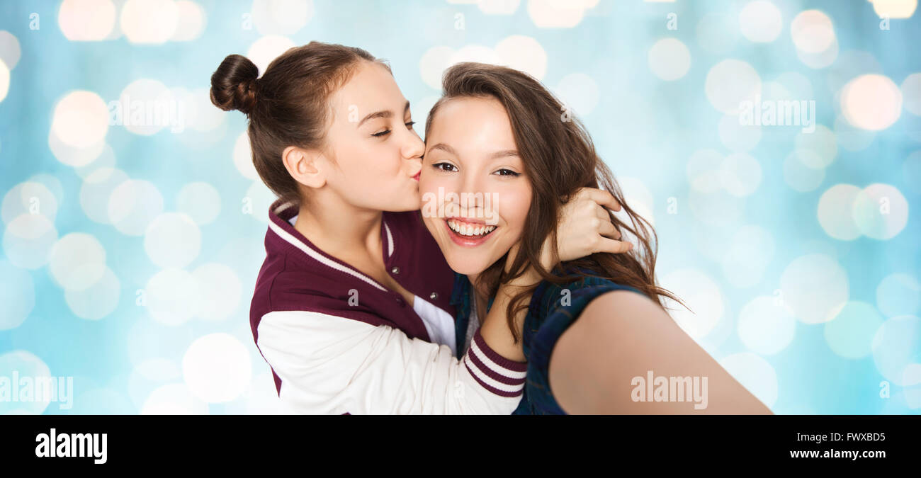 happy teenage girls taking selfie and kissing Stock Photo