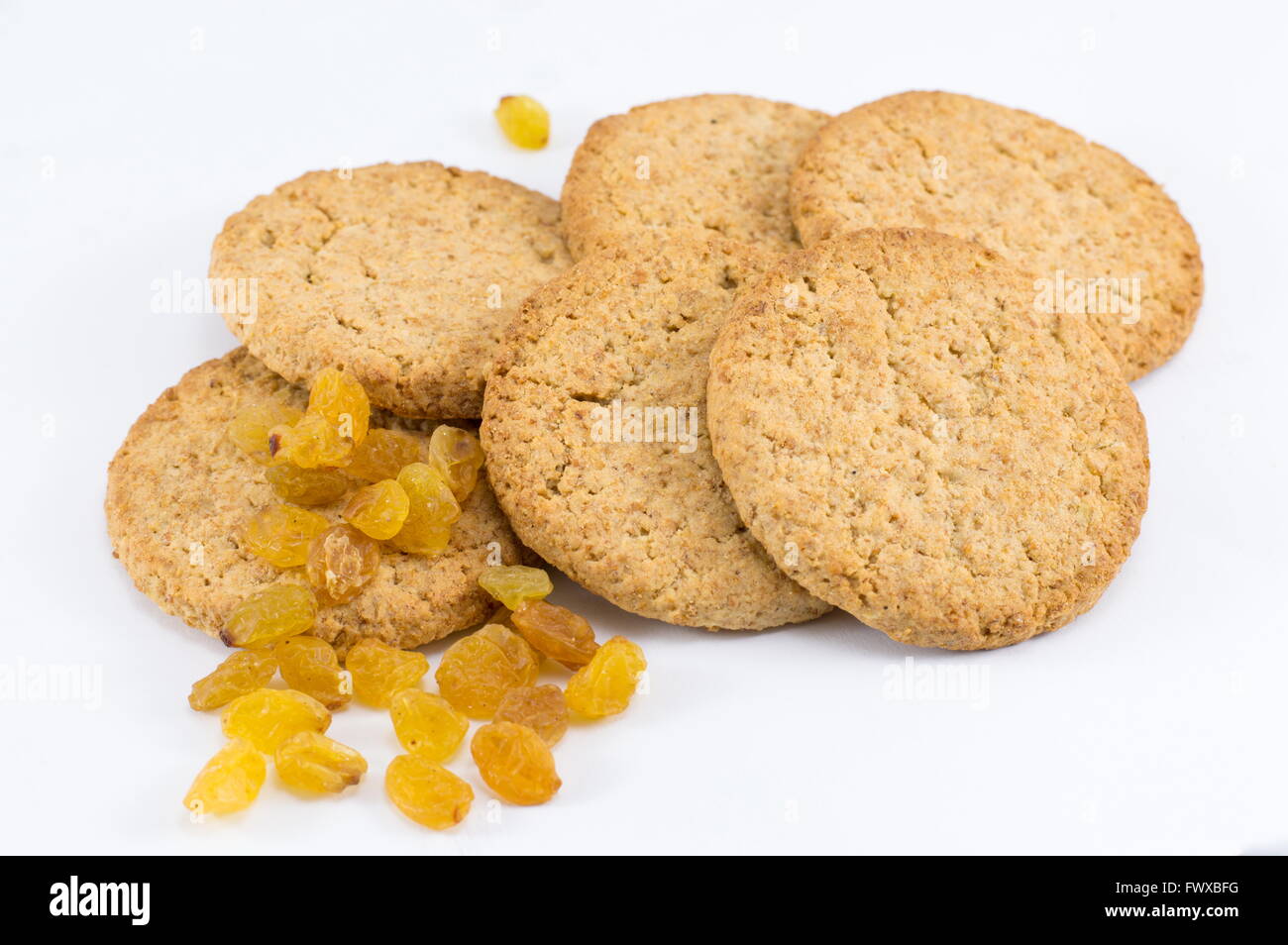 Integral cookies with yellow raisins on white Stock Photo