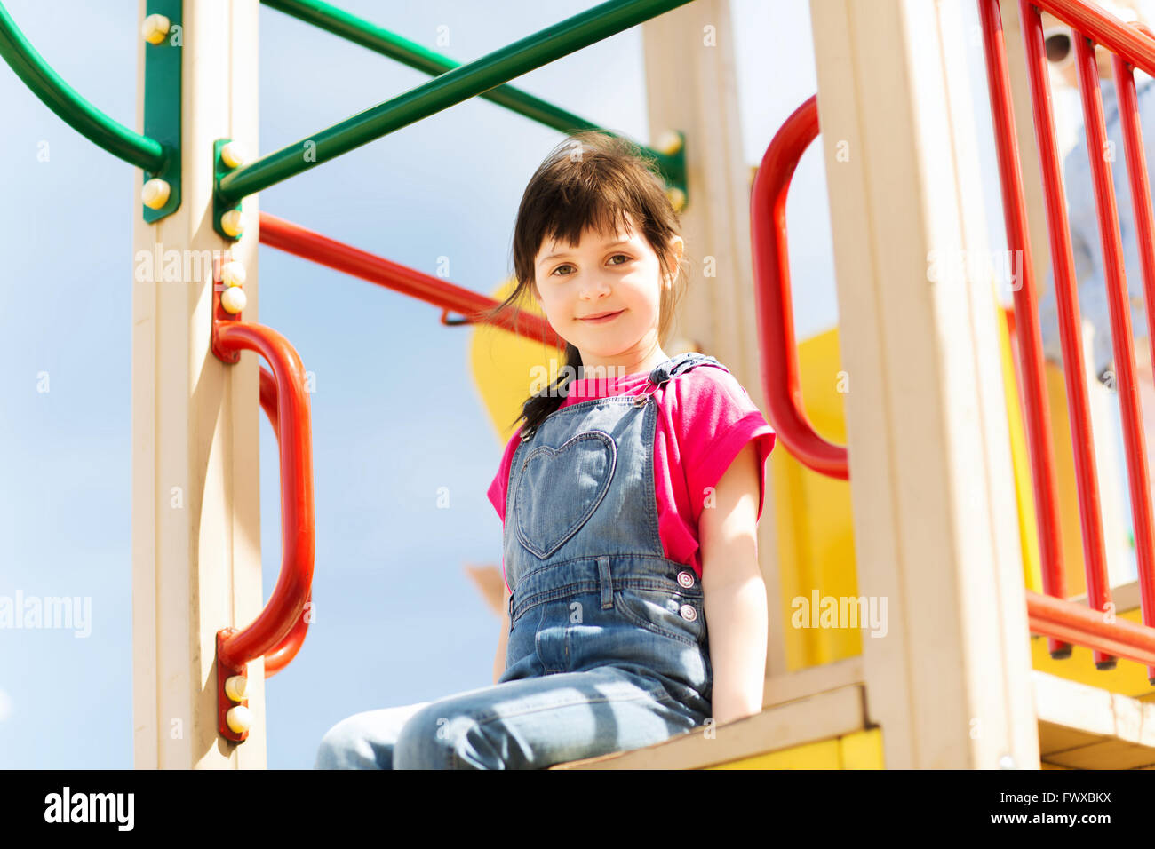 happy little girl on children playground Stock Photo - Alamy