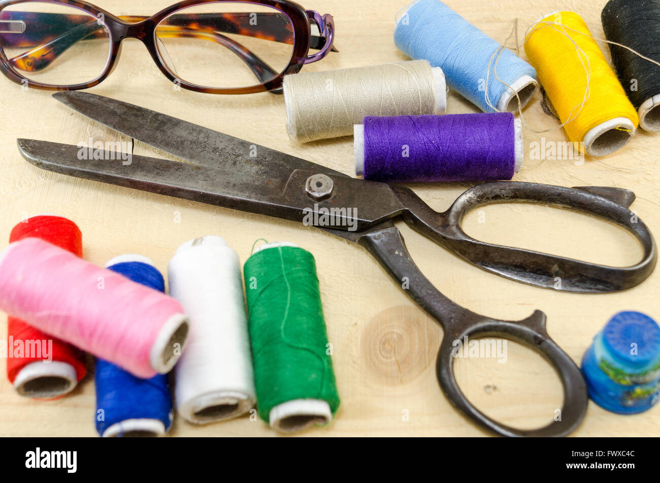 Sewing equipment chaos scattered on the table Stock Photo
