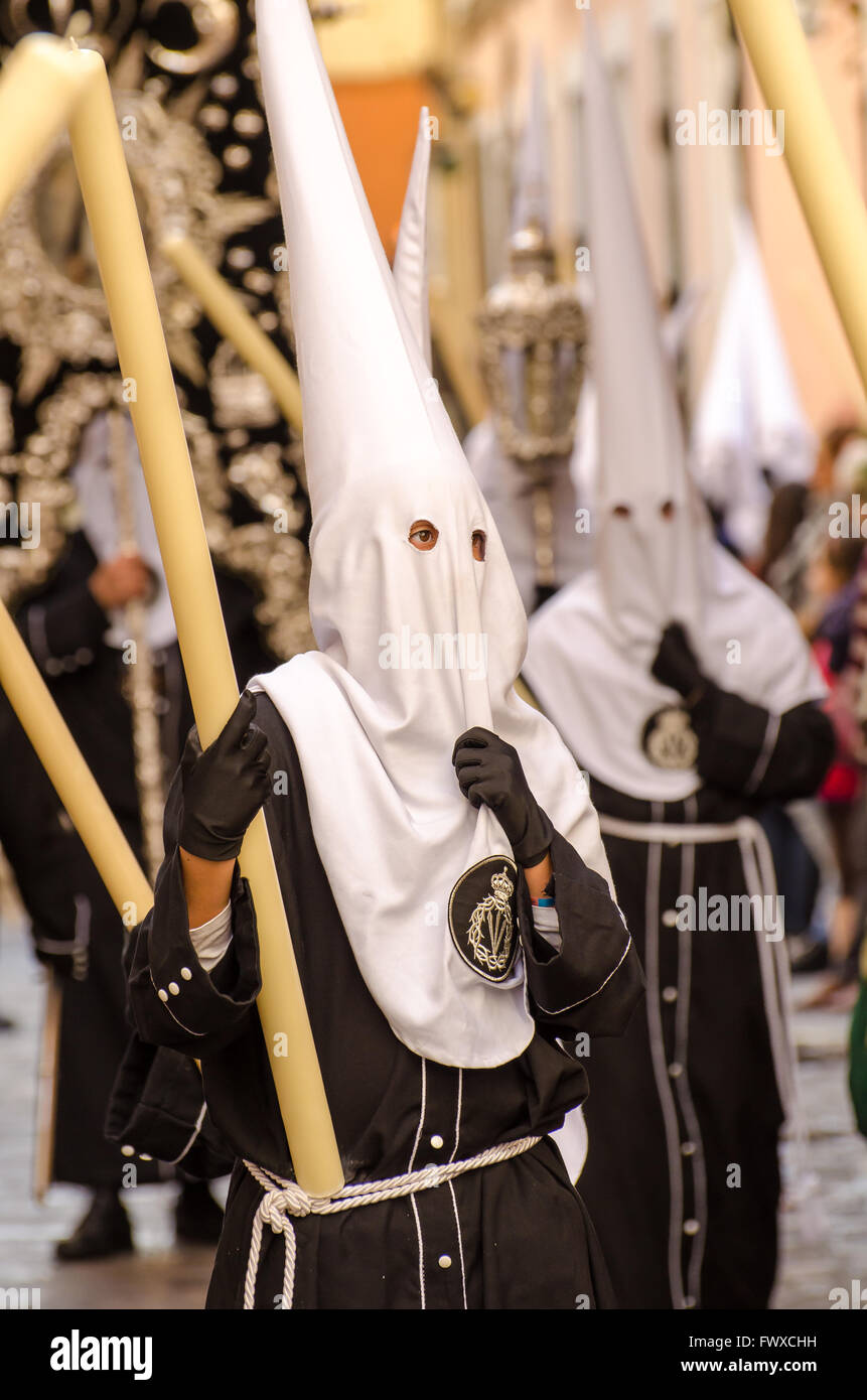 Hooded Penitent Looks Contemplative During Semana Santa Processions