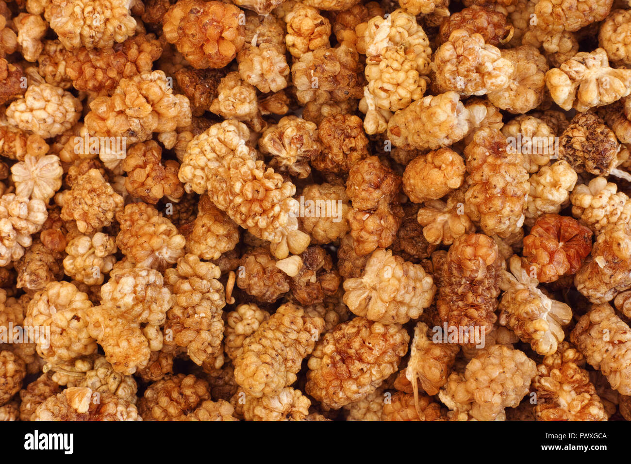 Sun dried white mulberries background. Close up. Stock Photo