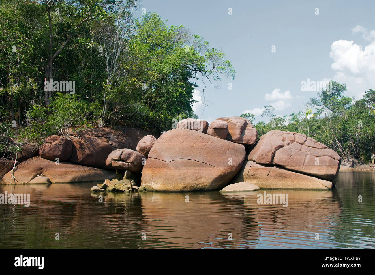Huge boulders & current blocks along Colombia's scenic Cano Bocon on the eastern Llanos offers prime fishing for Peacock Bass. Stock Photo