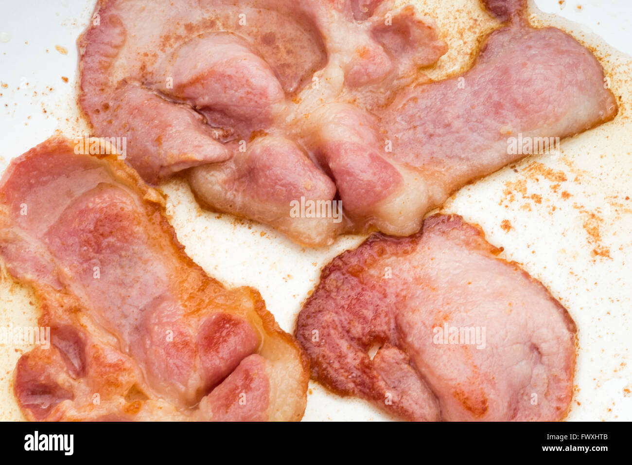 Bacon rashers cooking in a frying pan Stock Photo Alamy