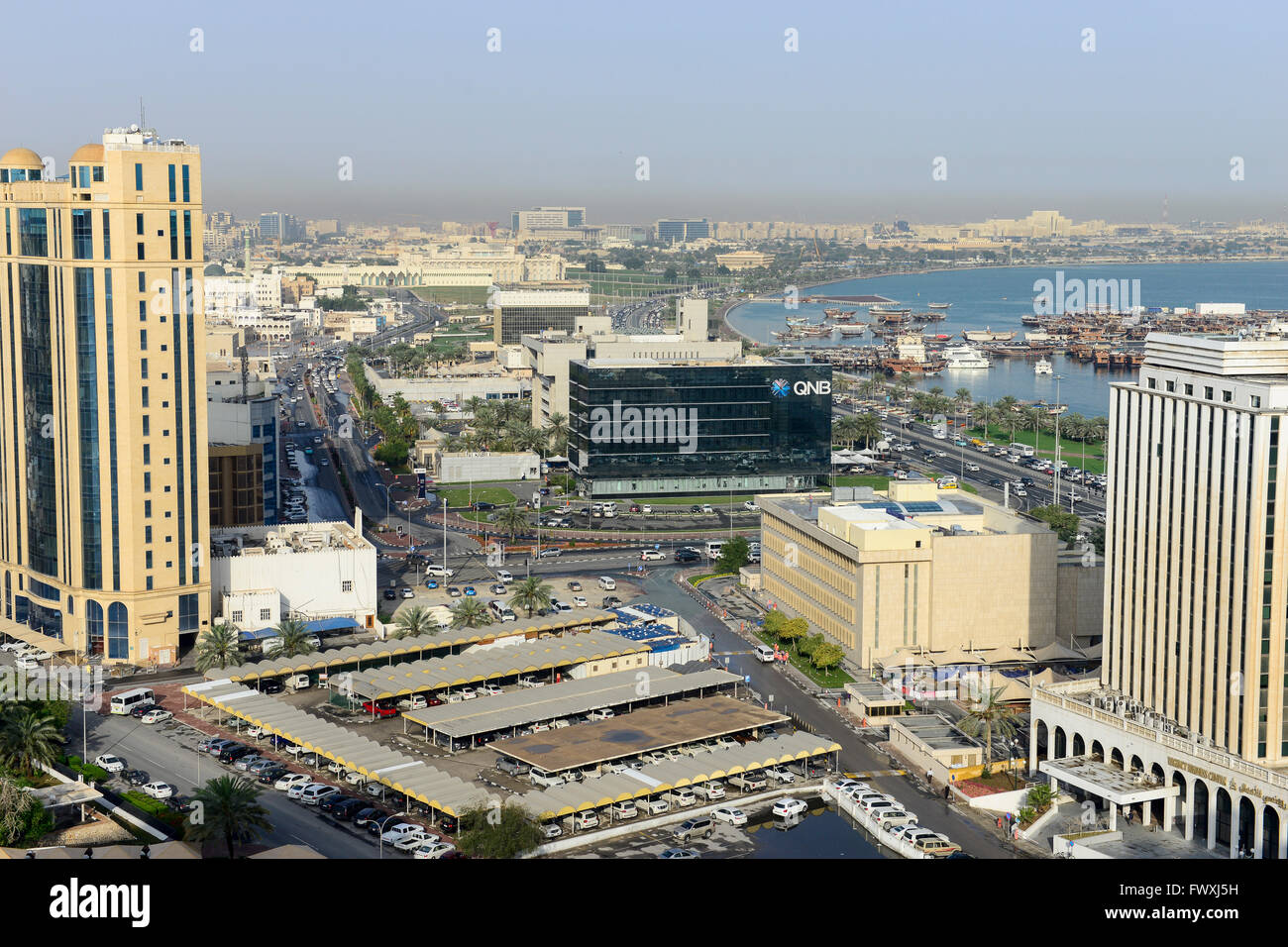 QATAR, Doha, downtown, view to  QNB QATAR National Bank, parliament and dhow harbour / KATAR, Doha, Blick zum Parlament und Bucht mit Dhau Hafen Stock Photo