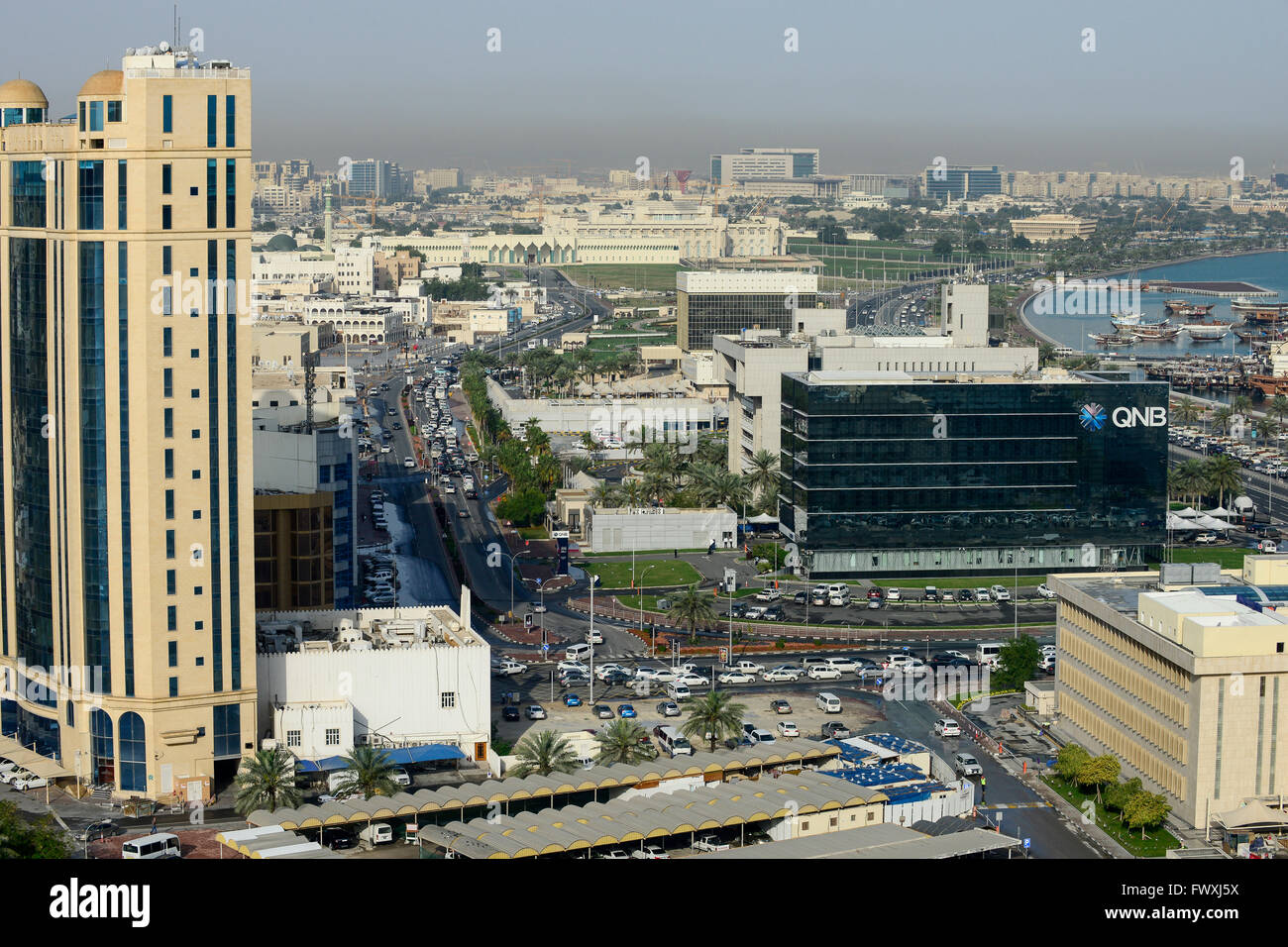 QATAR, Doha, downtown, view to  QNB QATAR National Bank, parliament and dhow harbour / KATAR, Doha, Blick zum Parlament und Bucht mit Dhau Hafen Stock Photo