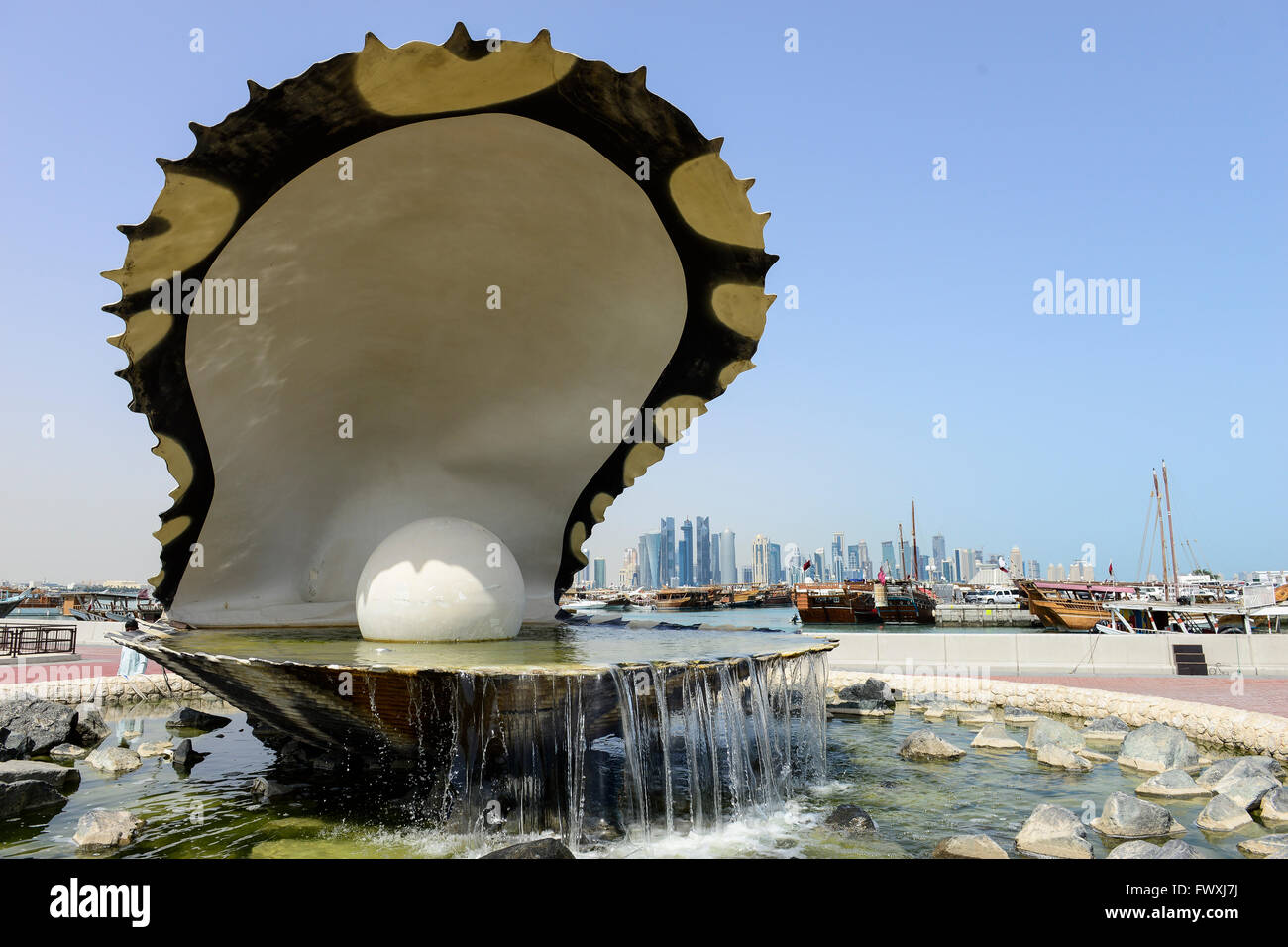QATAR, Doha, sculpture pearl shell, behind skyscraper east bay / KATAR