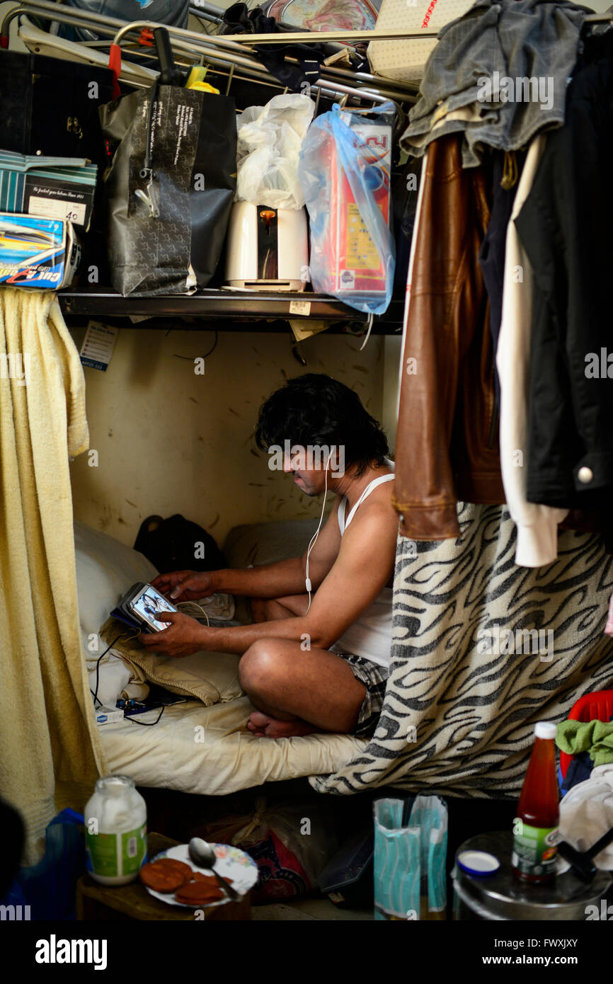 QATAR, Doha, industrial complex outside the city, housing camp for migrant worker , six filipino worker share a 10 square meter room, worker Noel communicates by Samsung tablet with his family in Manila Stock Photo