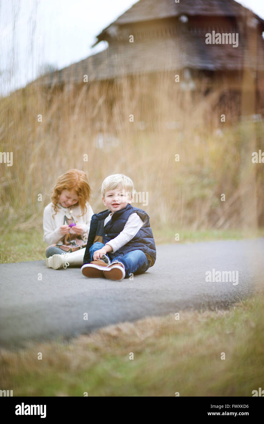 Family pictures of brother and sister at the park Stock Photo - Alamy