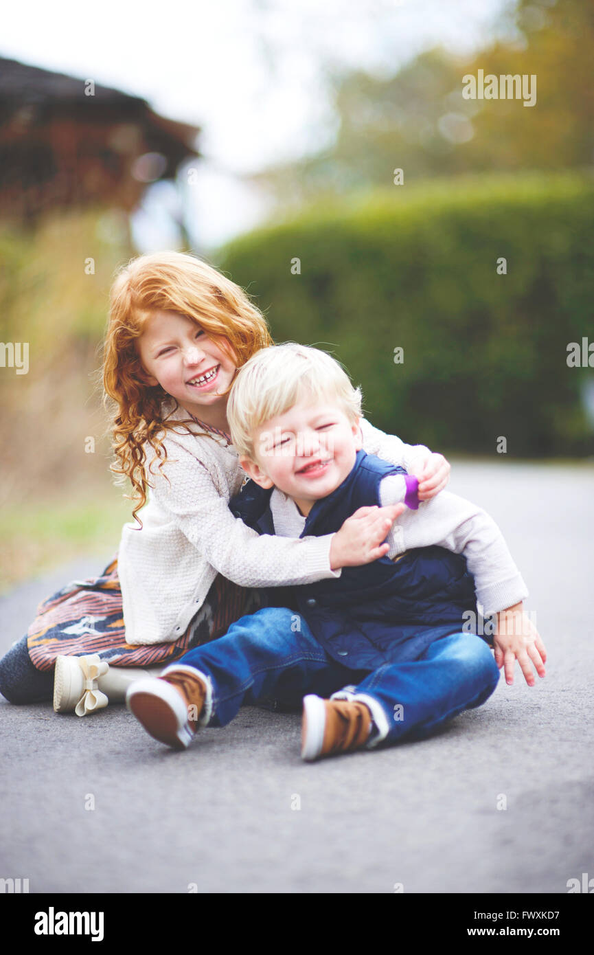 Family pictures of brother and sister at the park Stock Photo - Alamy