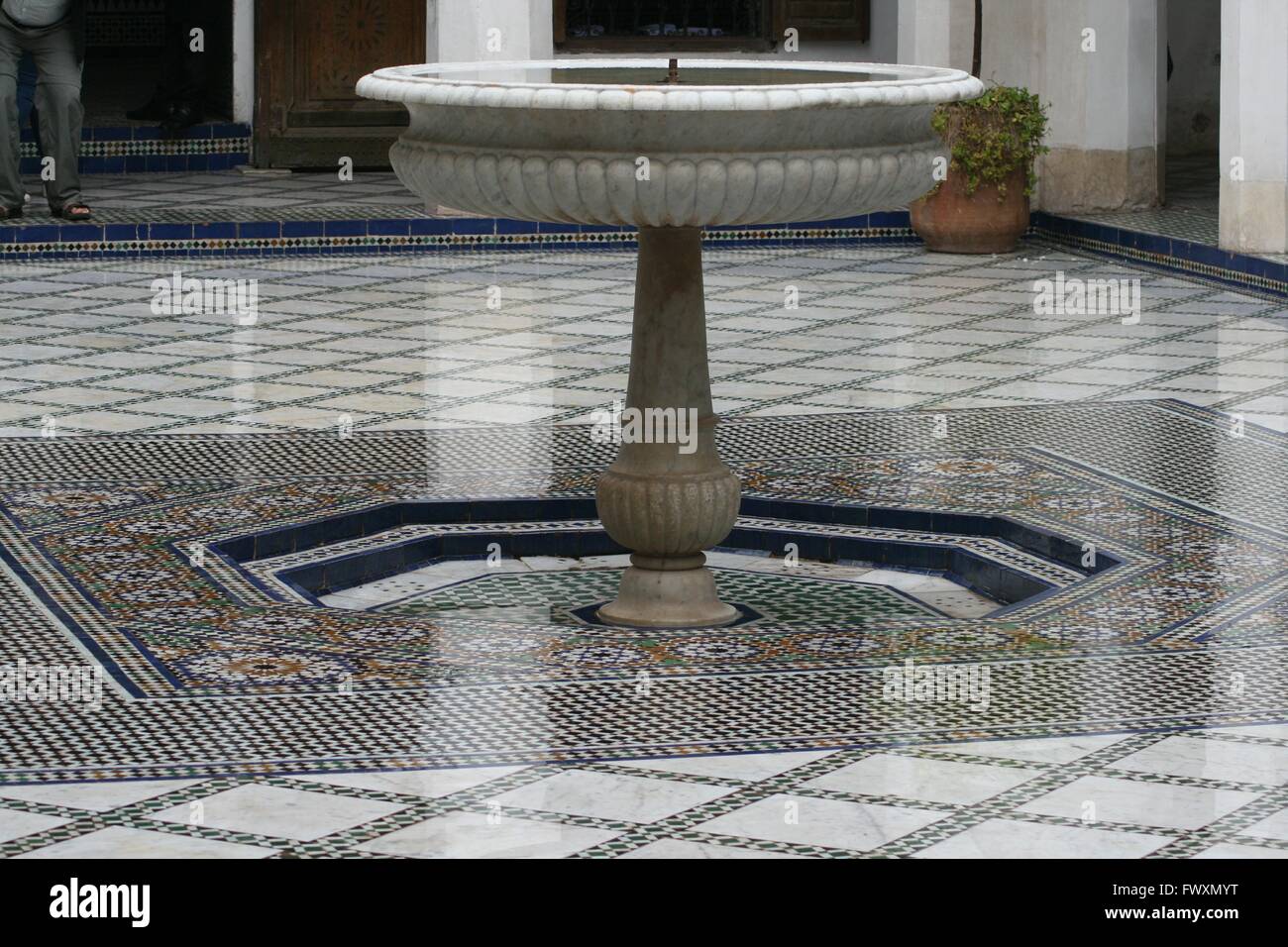 Mosaic floor and fountain in a Moroccan palace Stock Photo
