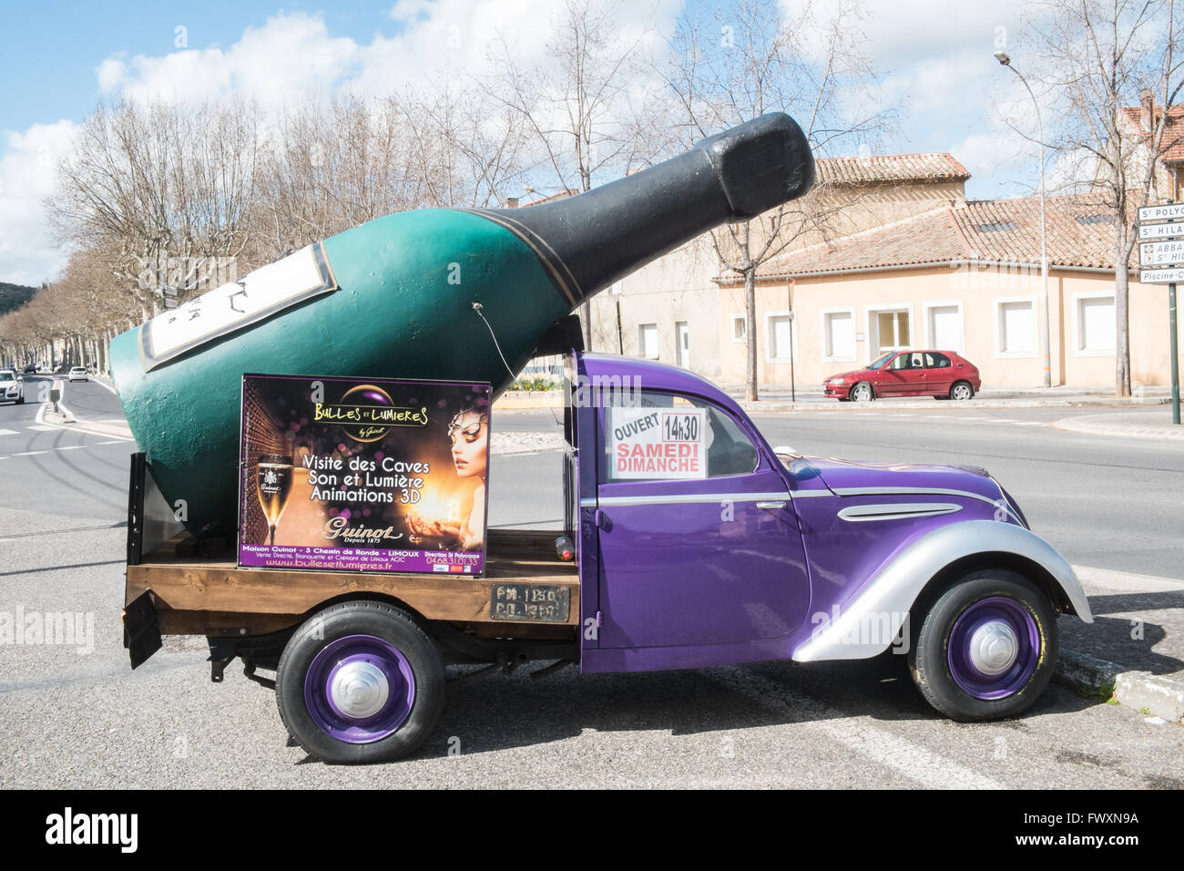 Bottle of wine,champagne on a vintage car,vehicle advertising wine