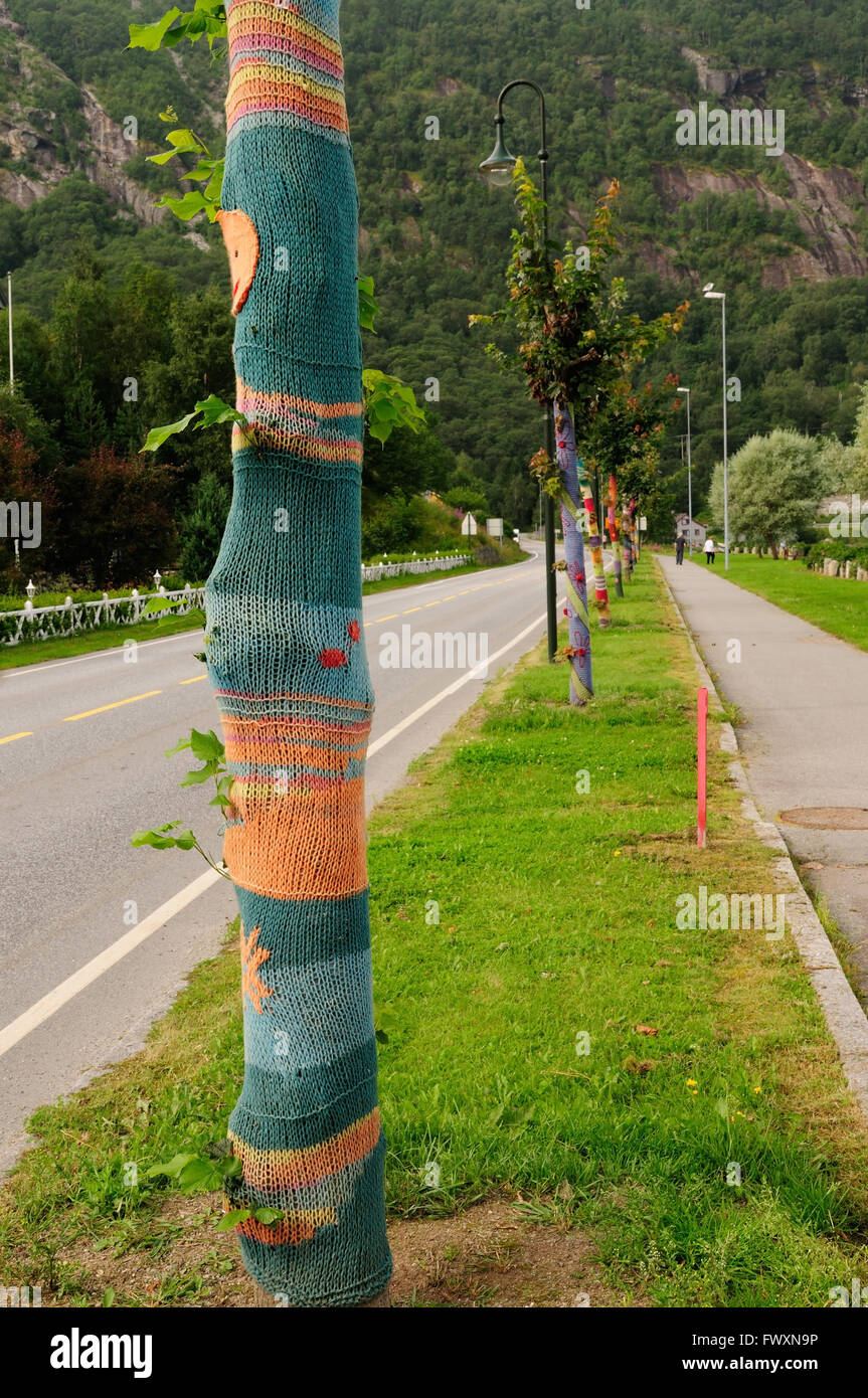 Roadside trees decorated with knitwear, known as yarn-bombing. Stock Photo