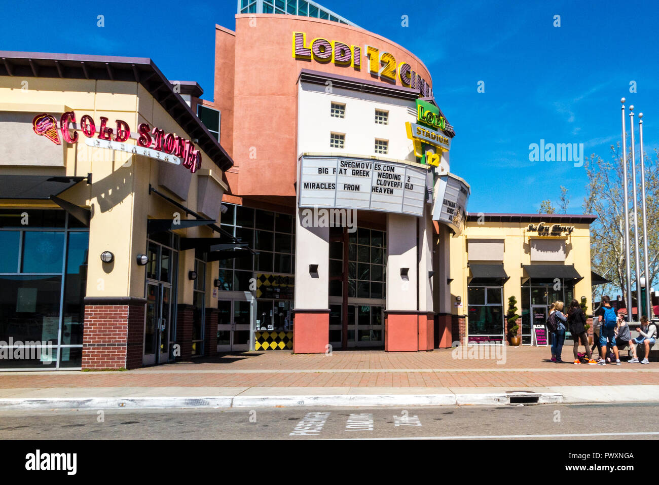 Young people standing in front of a multiplex theater in Lodi
