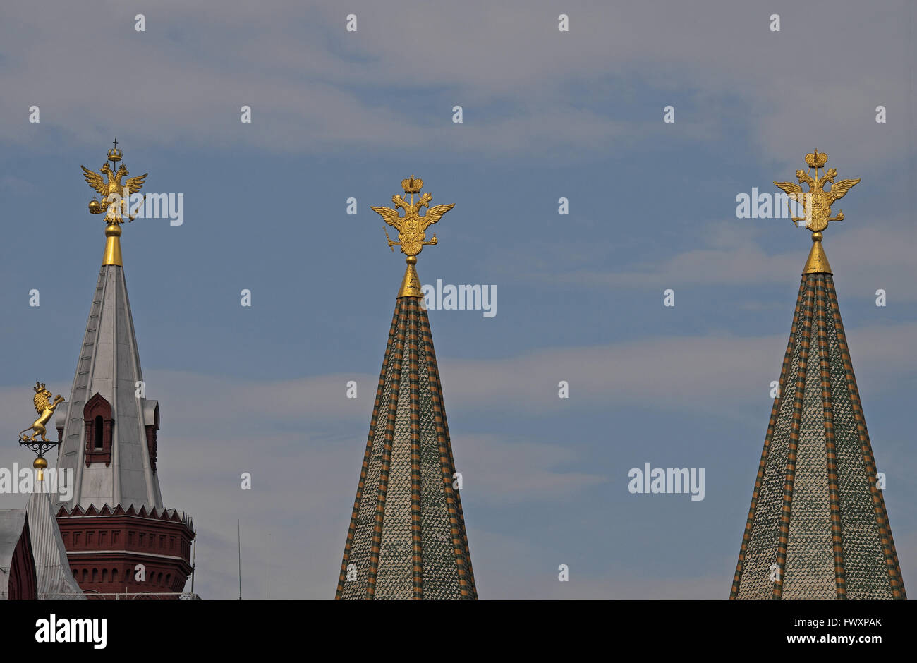 Golden lion and two headed eagle symbols on the Historical Museum (left) and Ressurection Gate, Red Square, Moscow, Russia. Stock Photo