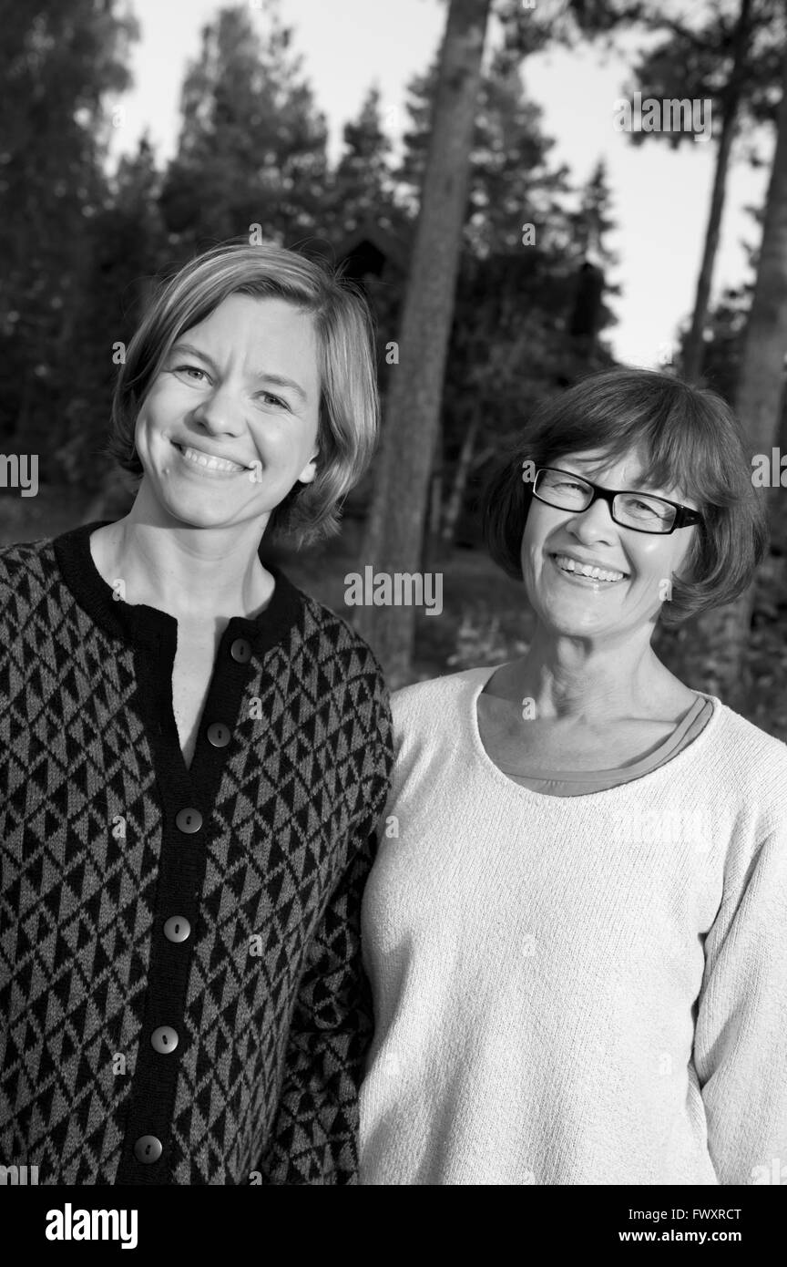 Sweden, Ostergotland, Portrait of two smiling women Stock Photo