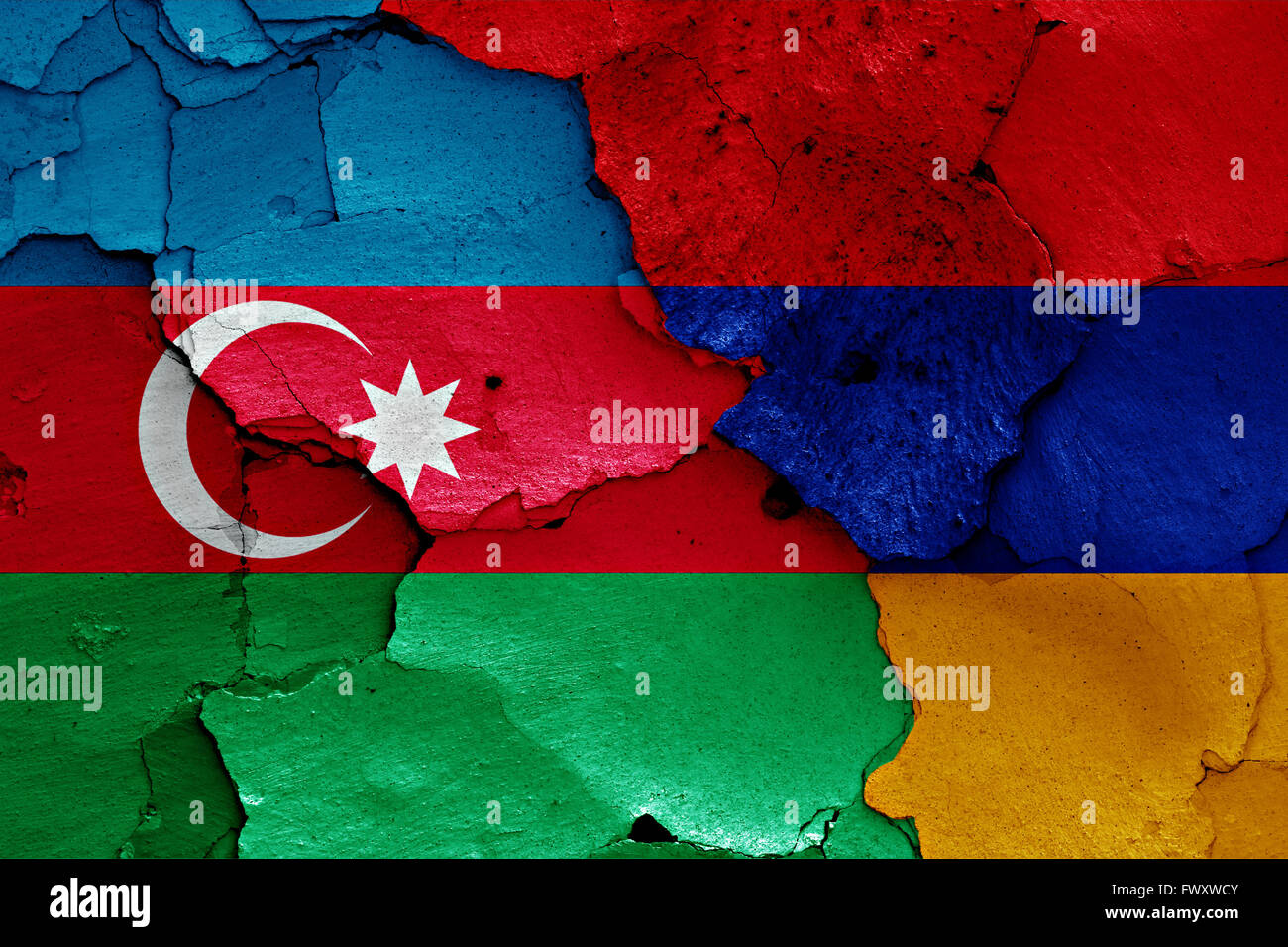 flags of Azerbaijan and Armenia painted on cracked wall Stock Photo