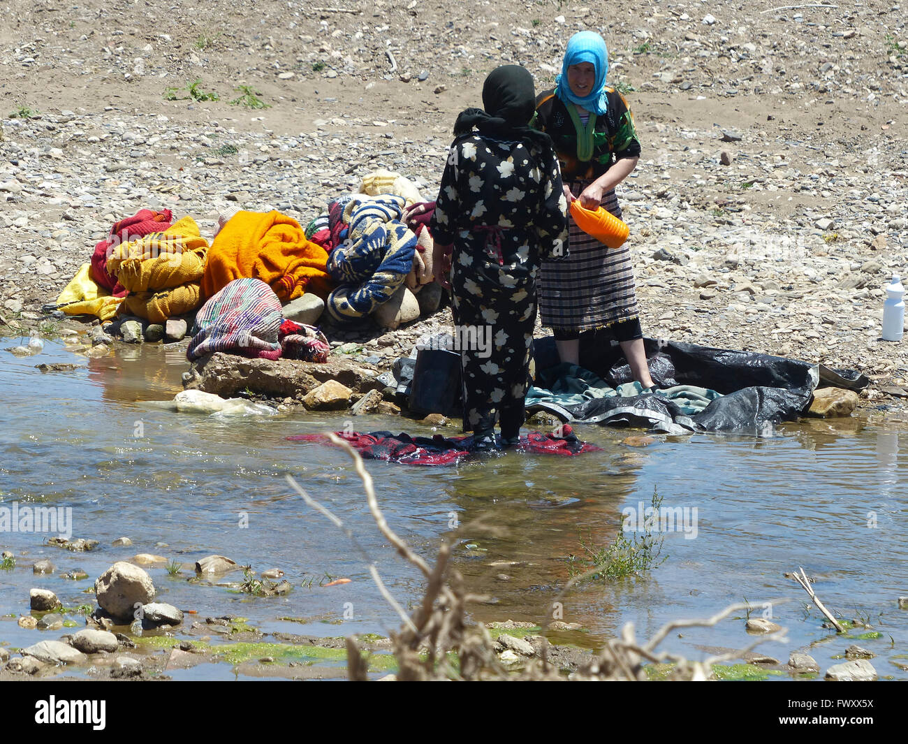 Women wash clothes in a river, Morocco Stock Photo Alamy
