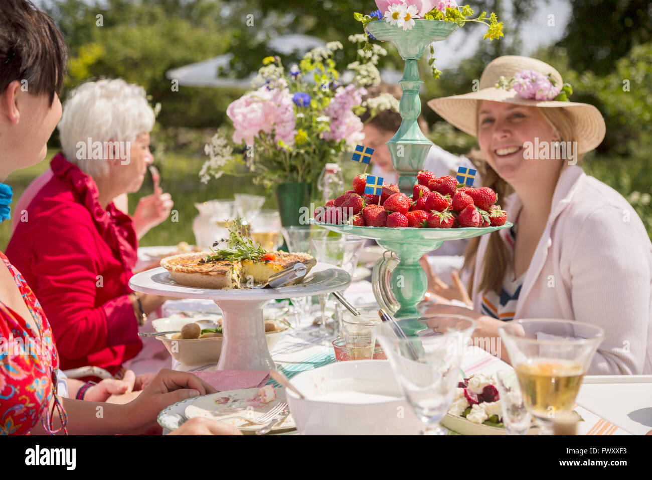 Sweden, Skane, Family during midsummer celebrations Stock Photo