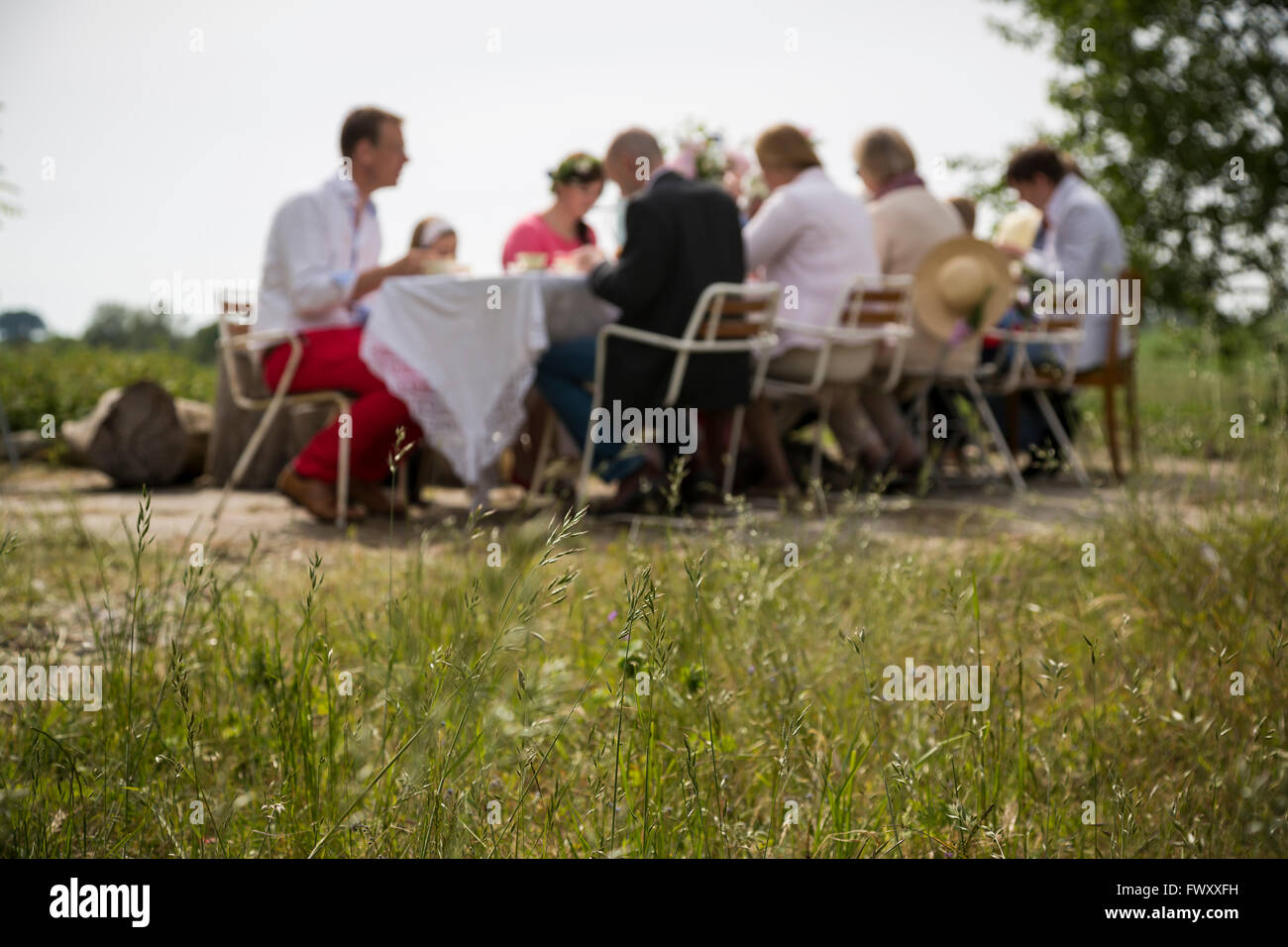 Sweden, Skane, Family with one child (8-9) during midsummer celebrations Stock Photo