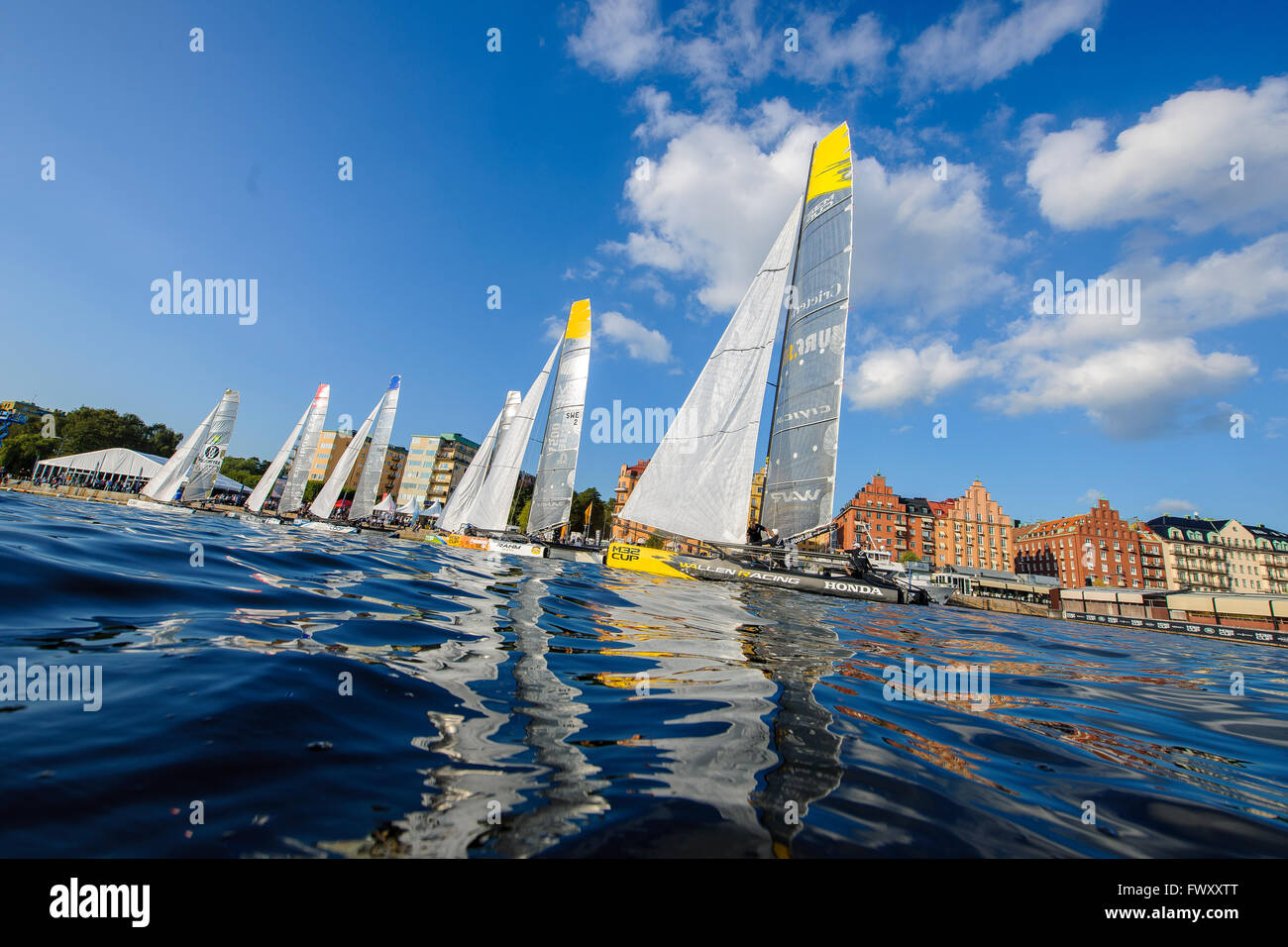 Sweden, Stockholm, Riddarfjarden, Sailboats sailing on lake with old