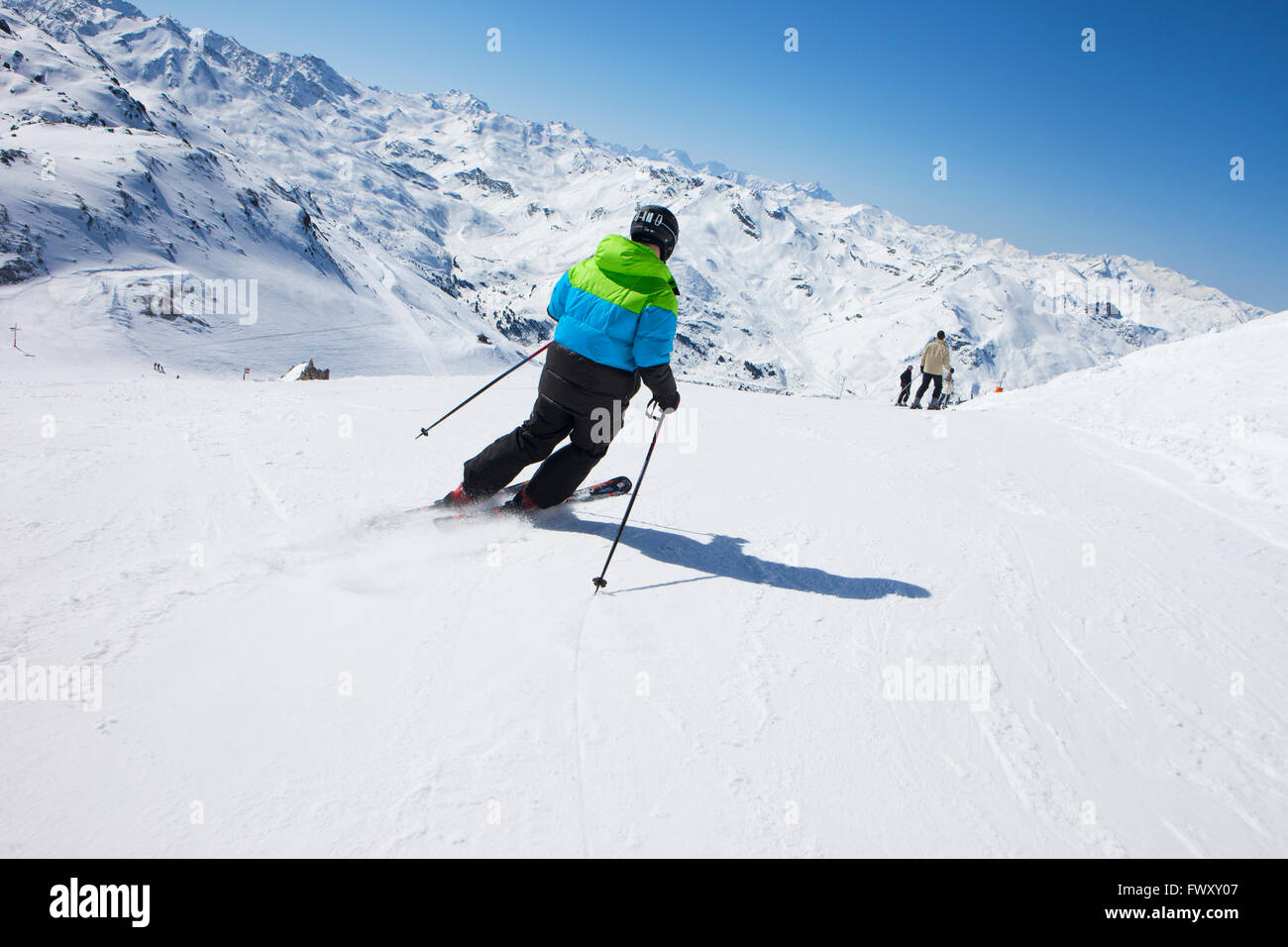 France, Val Thorens, Man skiing on mountain slope Stock Photo