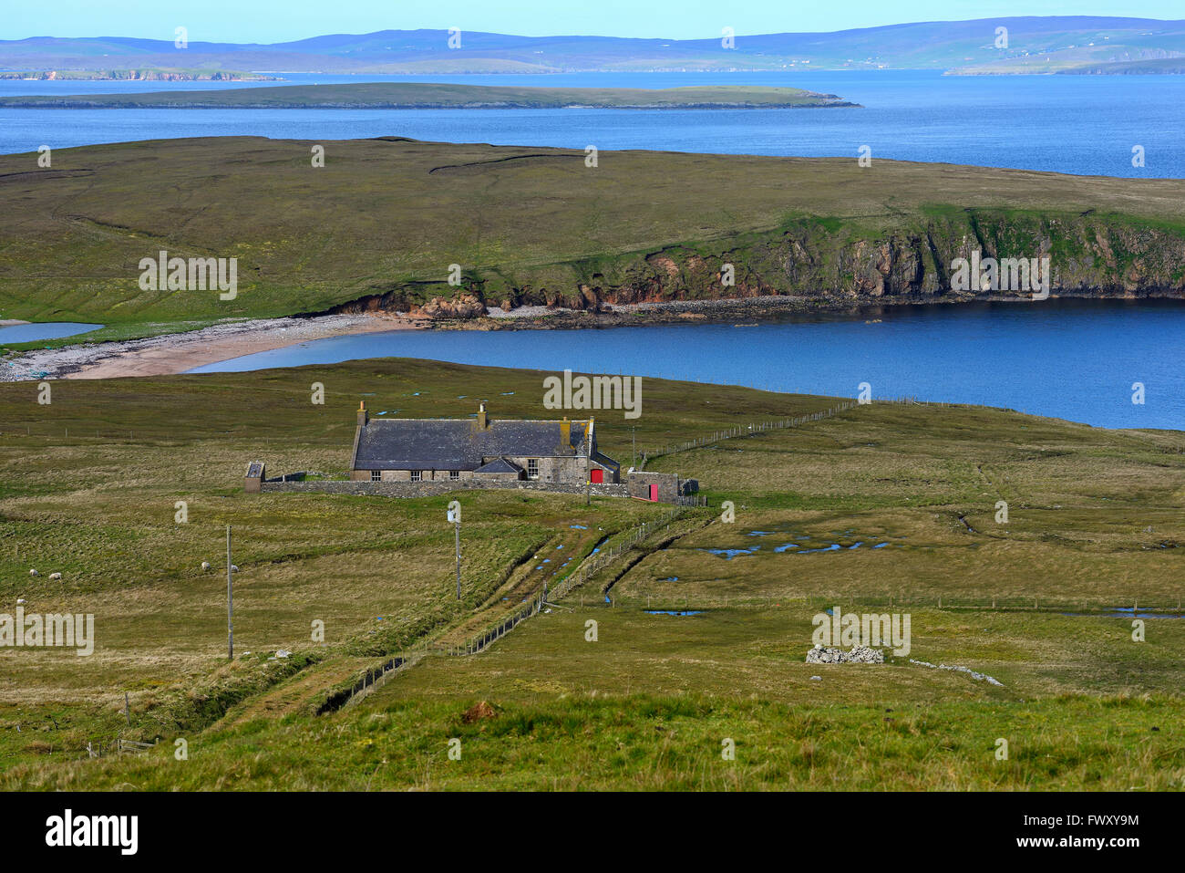 UK, Scotland, Shetland, Yell, West Sandwick, Old hut by sea Stock Photo