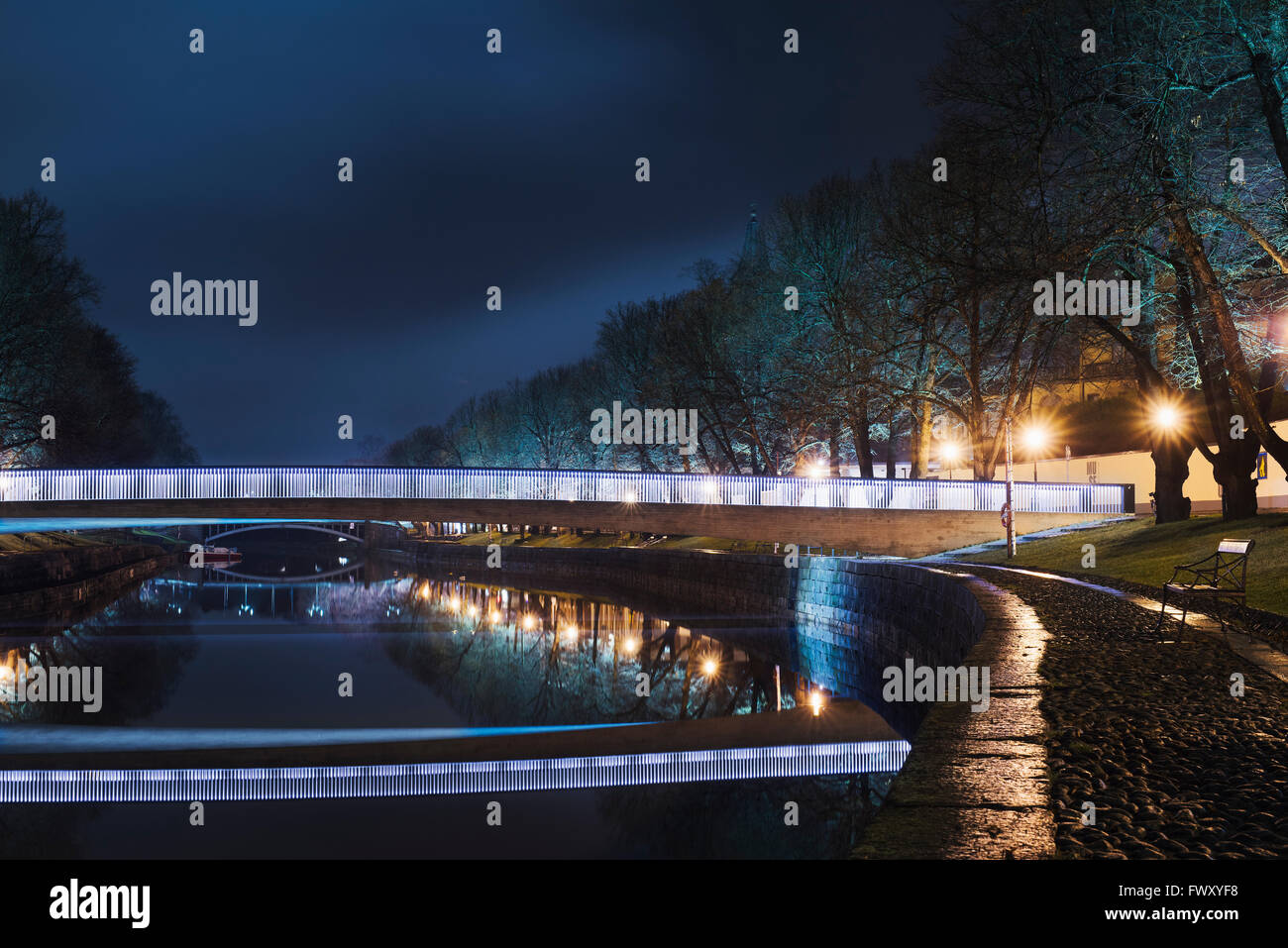Finland, Varsinais-Suomi, Turku, Illuminated bridge over river at night Stock Photo