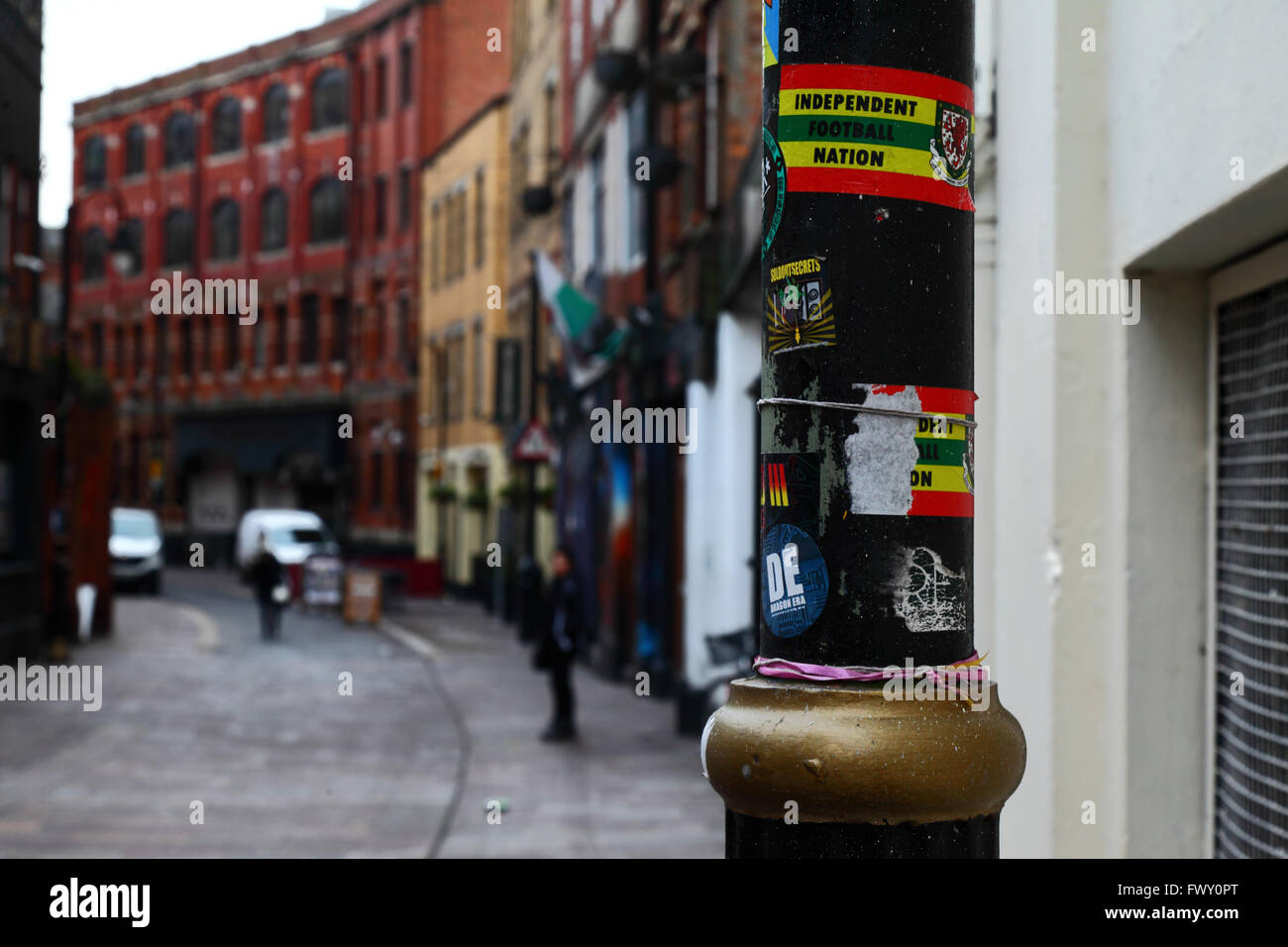 Independent football nation stickers on lamp post in Womanby Street, Cardiff, South Glamorgan, Wales, United Kingdom Stock Photo