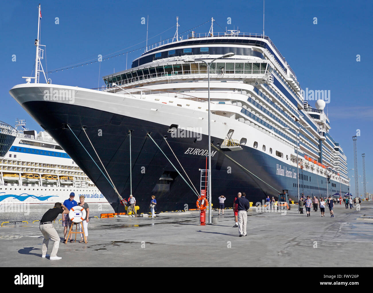 Cruise ship passengers being photogrphed by ship photographer upon arrivel in port of Tallinn, Estonia. Stock Photo