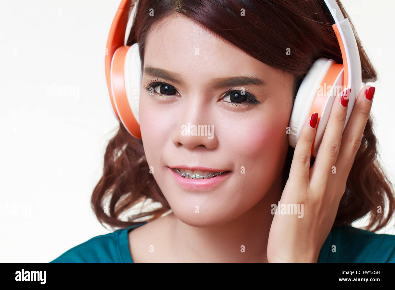 Beautiful young woman with headphones listening to the music Stock ...