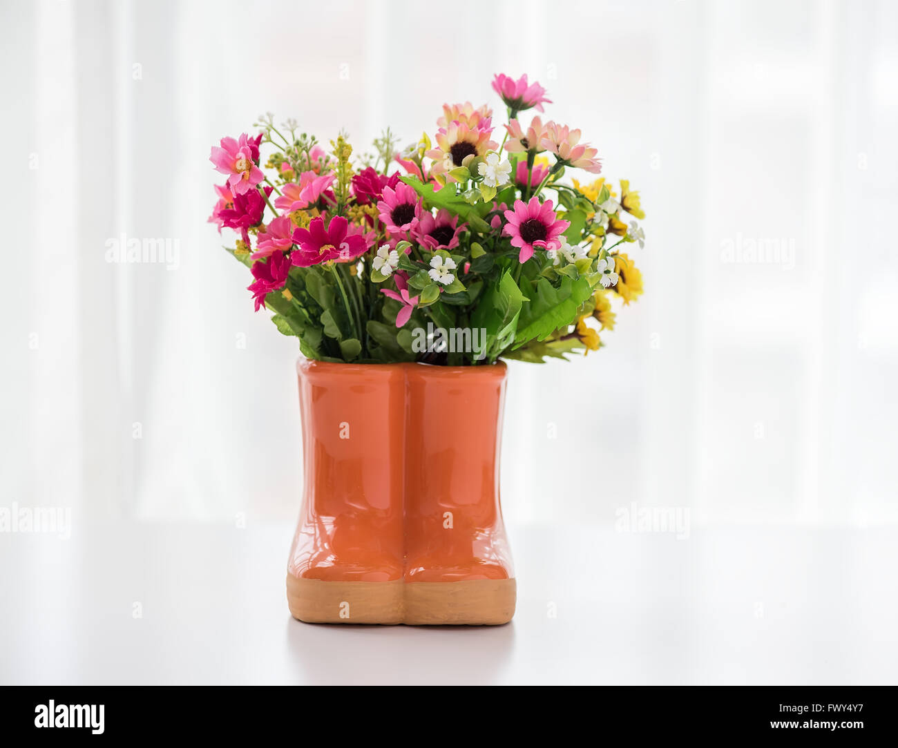 decorations for the garden. boots with flowers Stock Photo